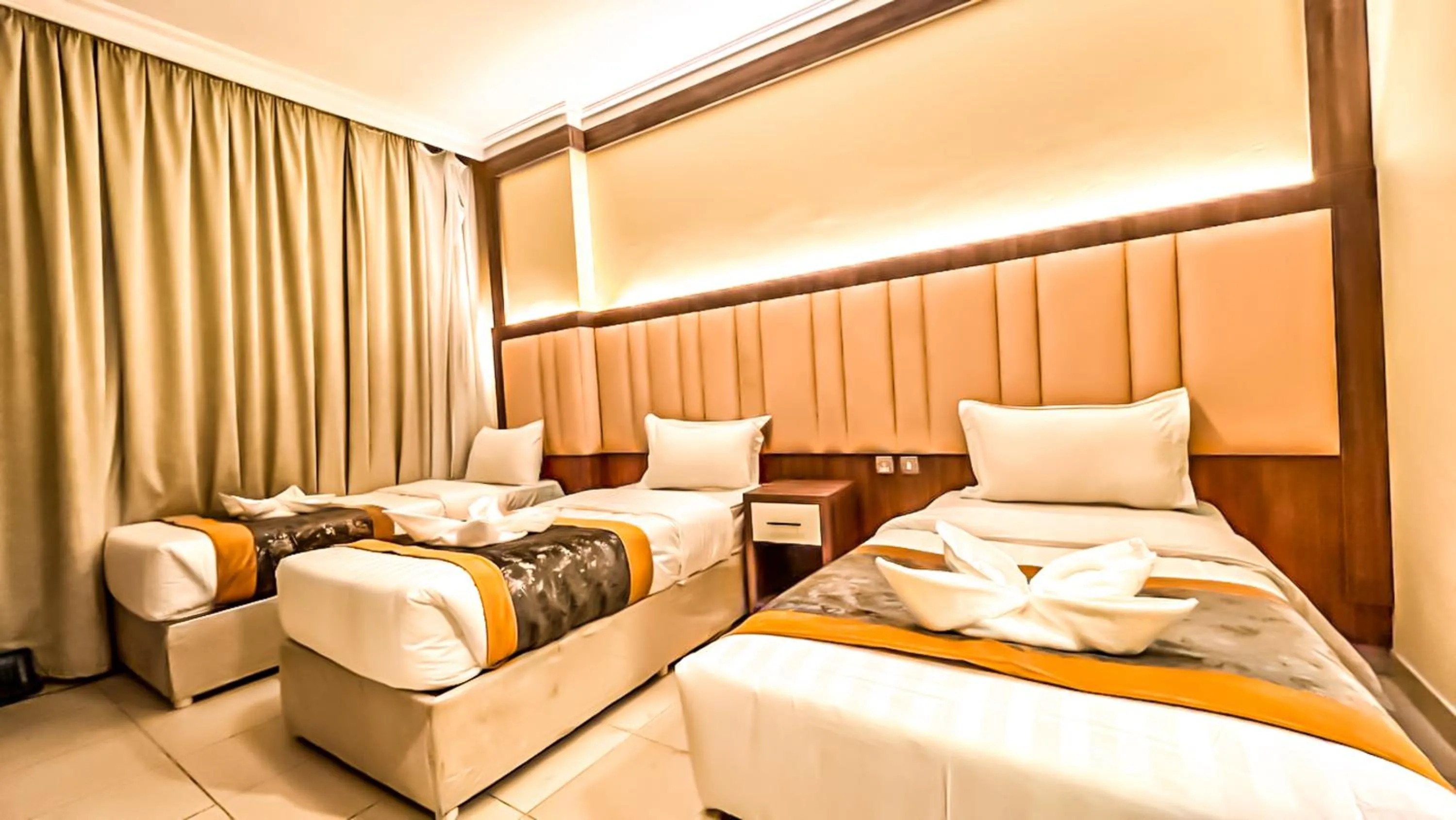 Bed in Diyafa Al Mukhtara Hotel