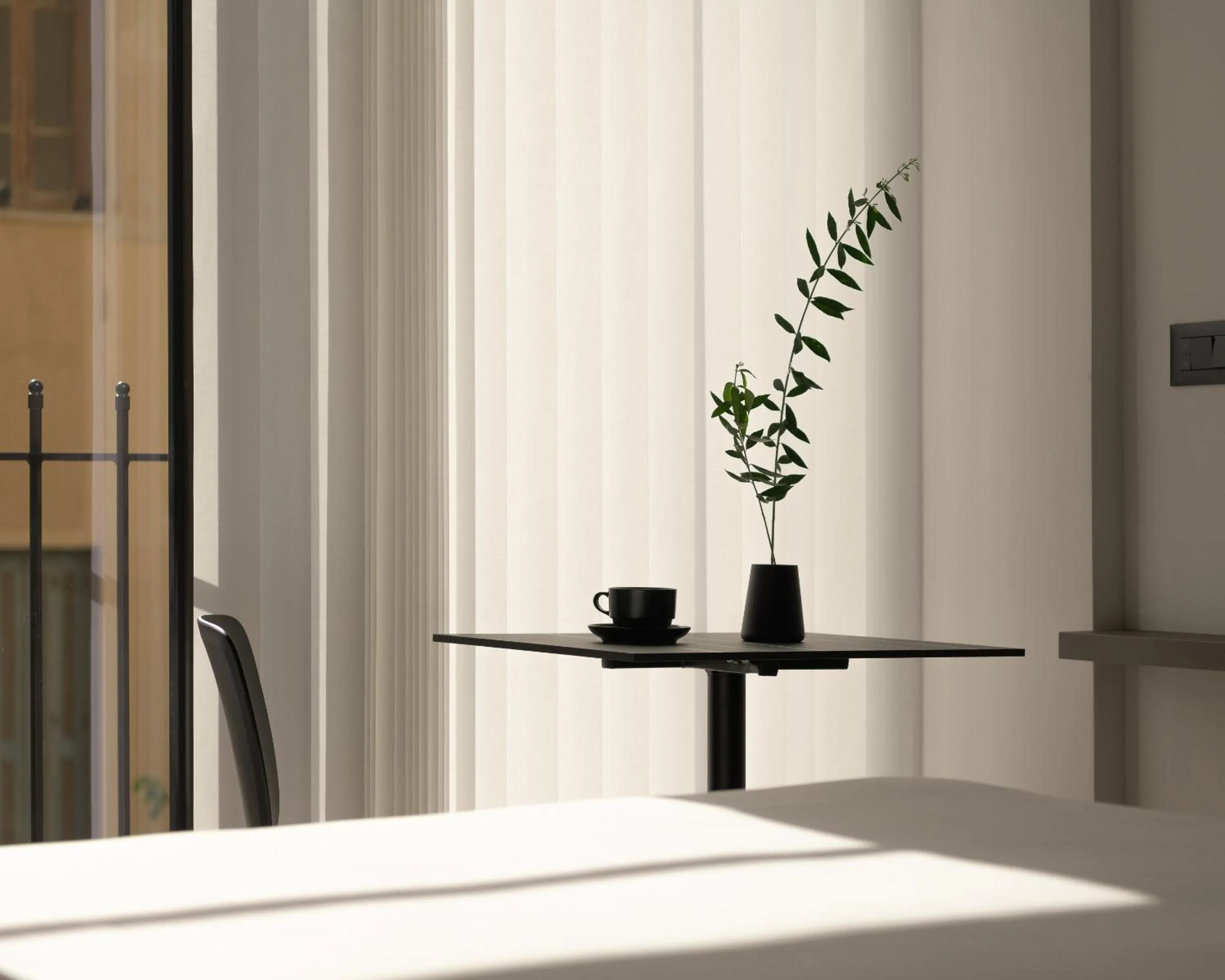 Seating area in Pleiades Urban Stay by Semavί