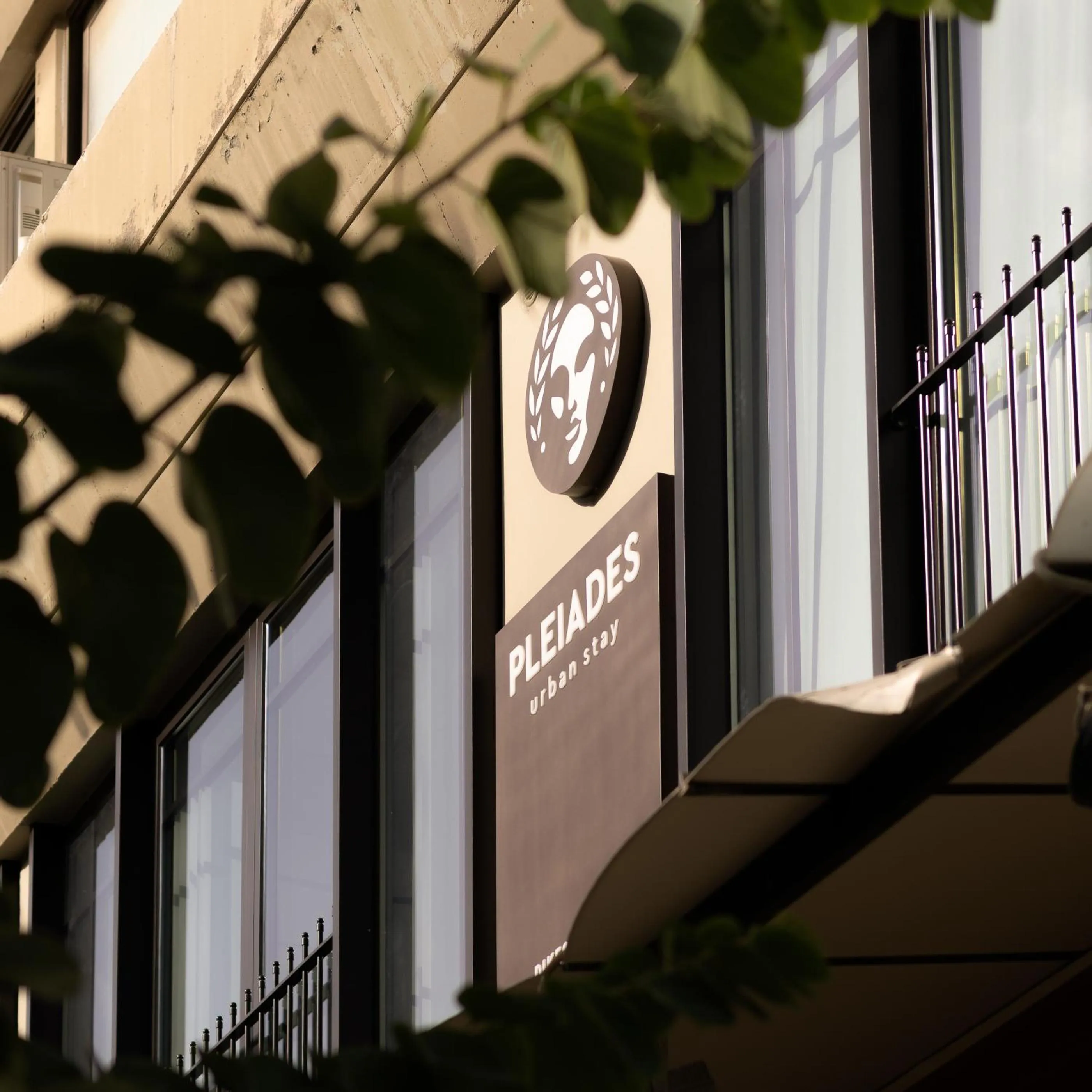 Property logo or sign in Pleiades Urban Stay by Semavί