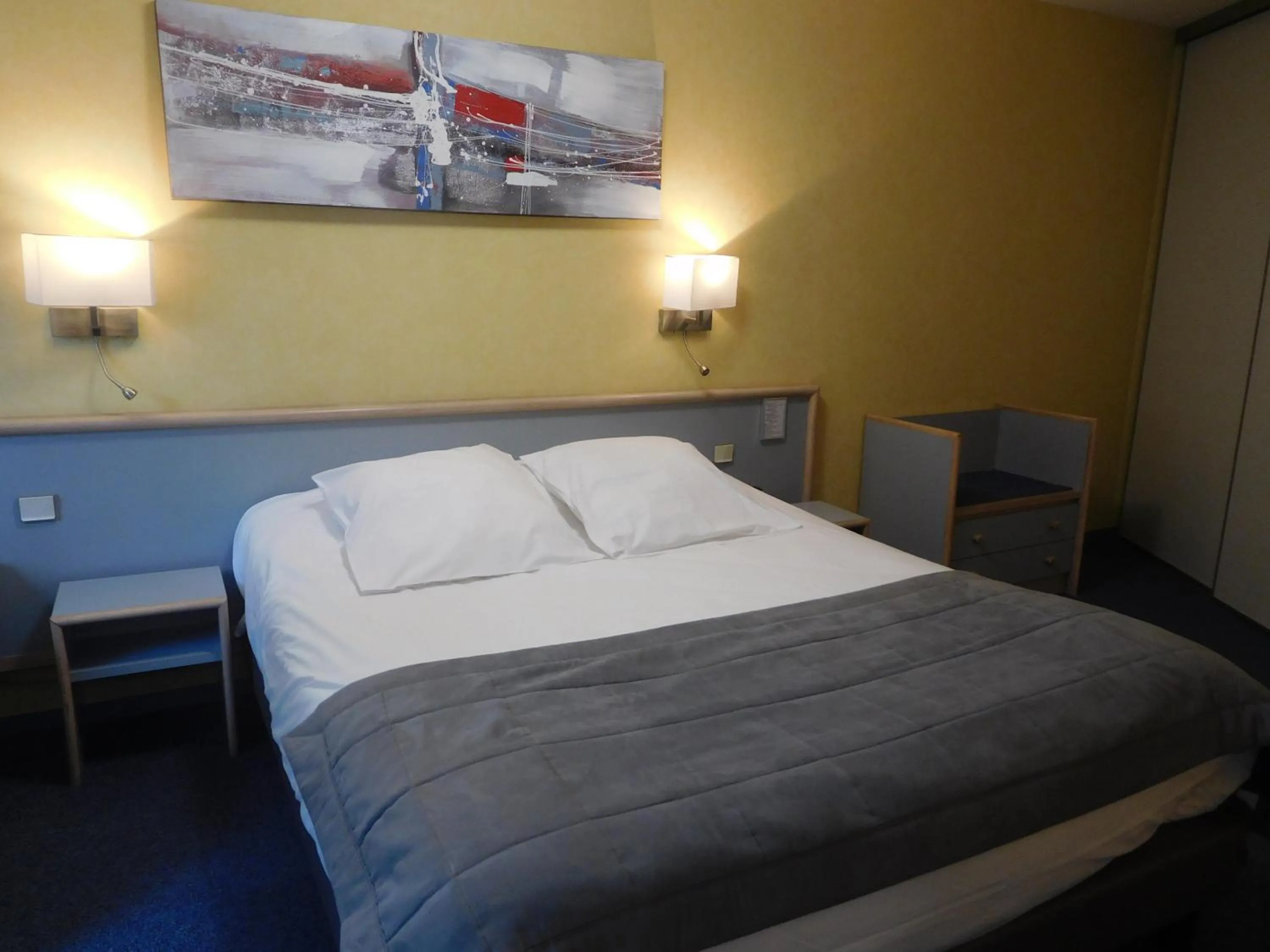 Bed in Au Relais de l'Oust