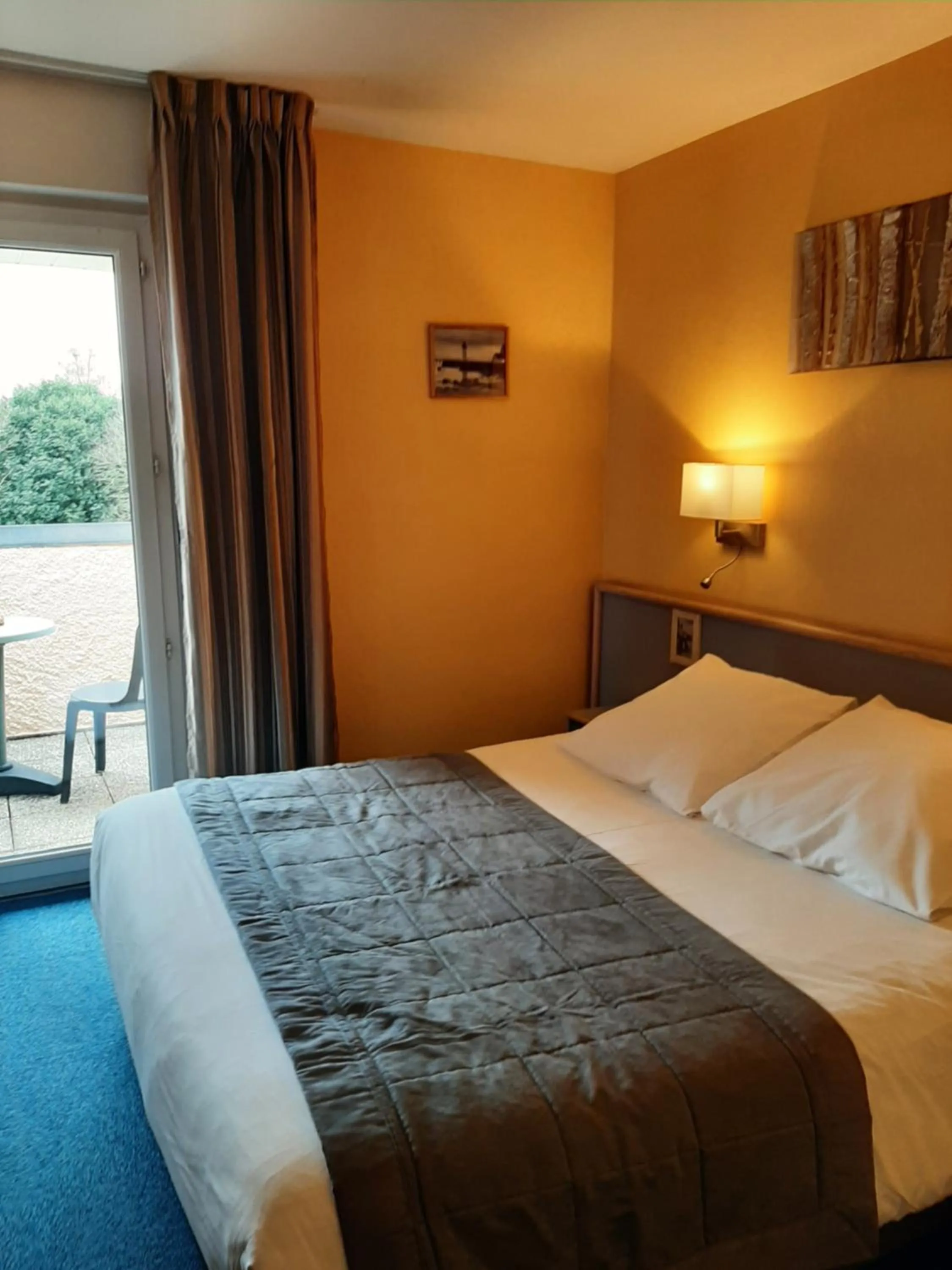 Bed in Au Relais de l'Oust