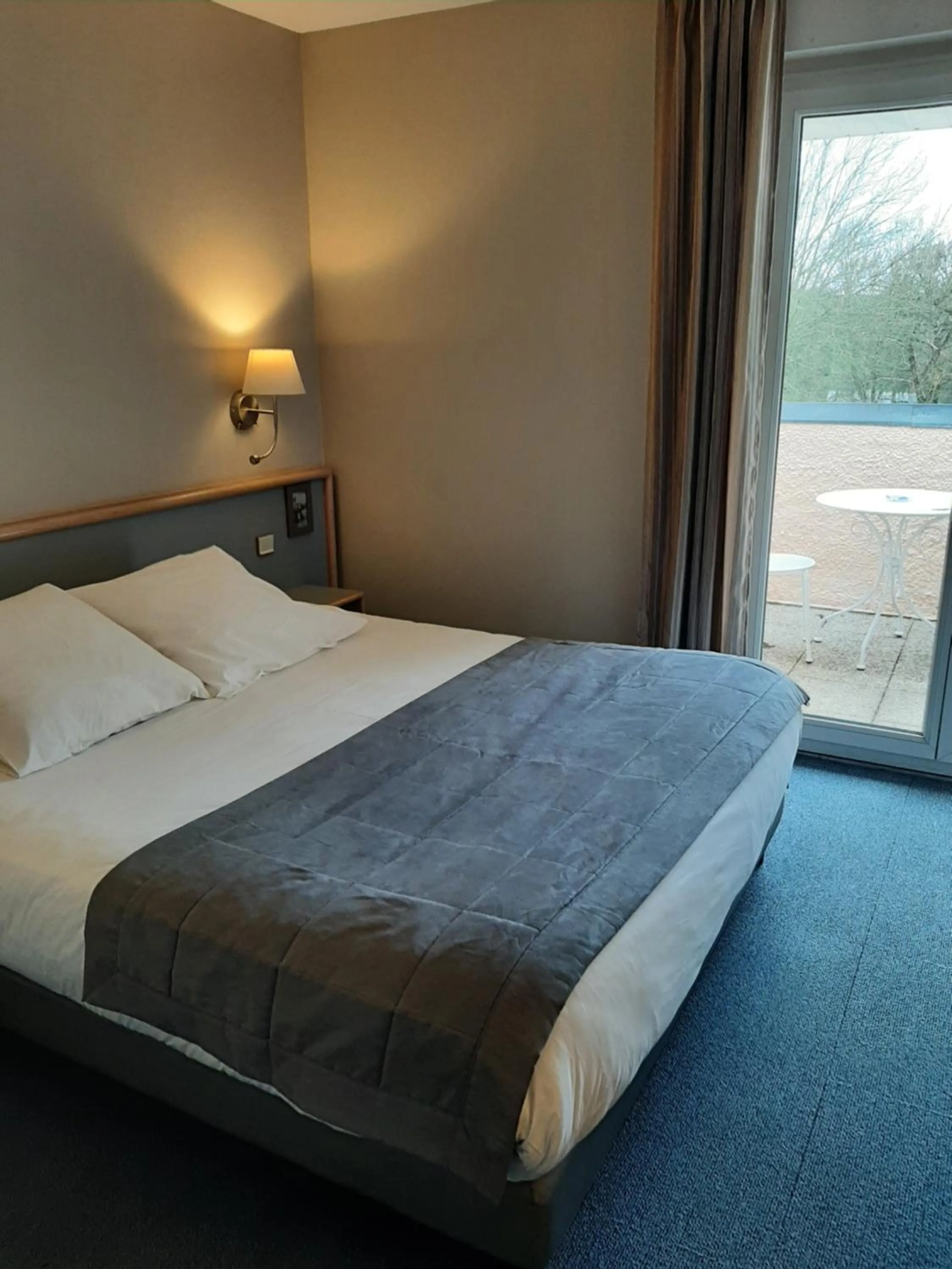 Bed in Au Relais de l'Oust