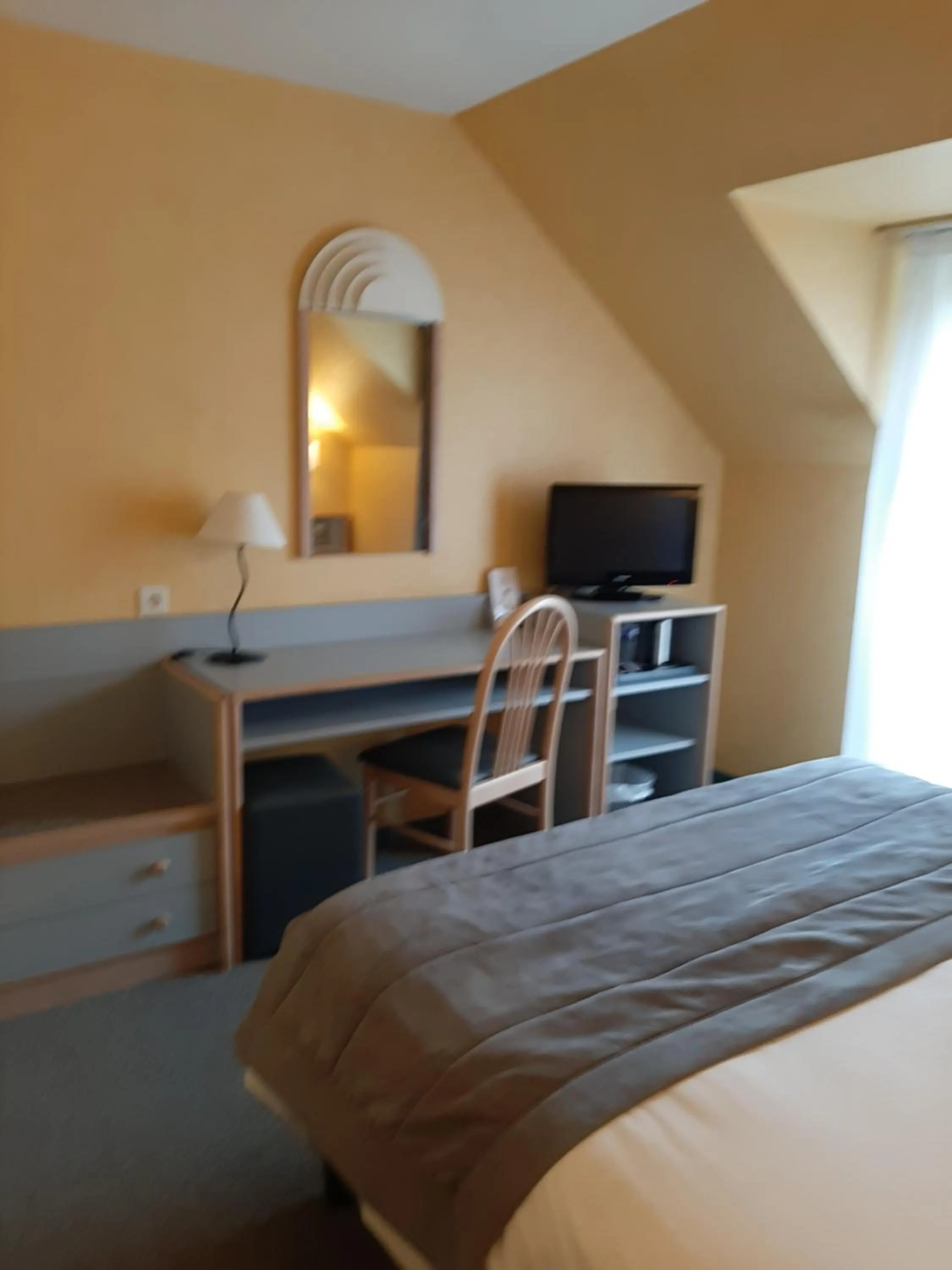 Bed in Au Relais de l'Oust