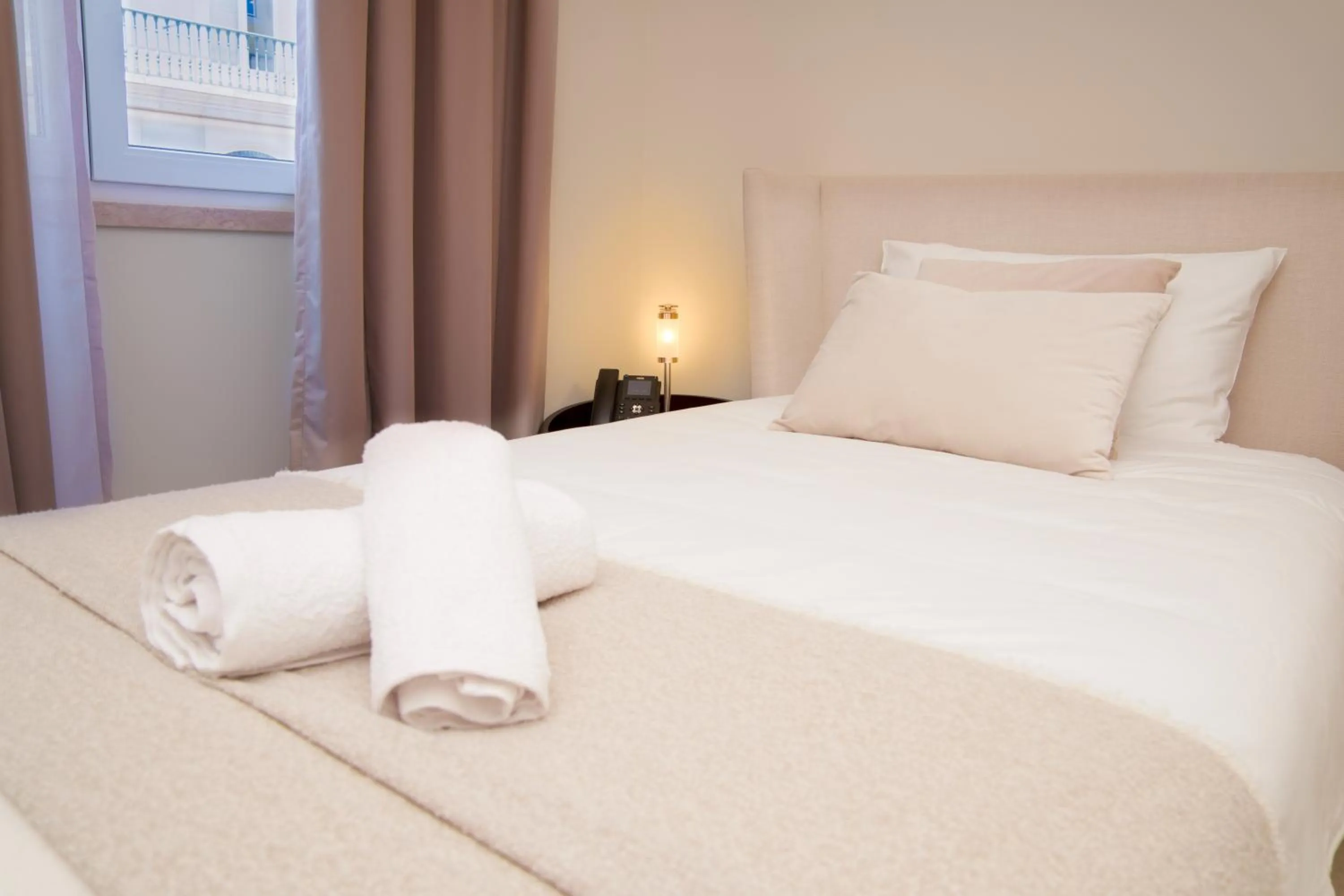 Bed in Golden Lisbon Hotel