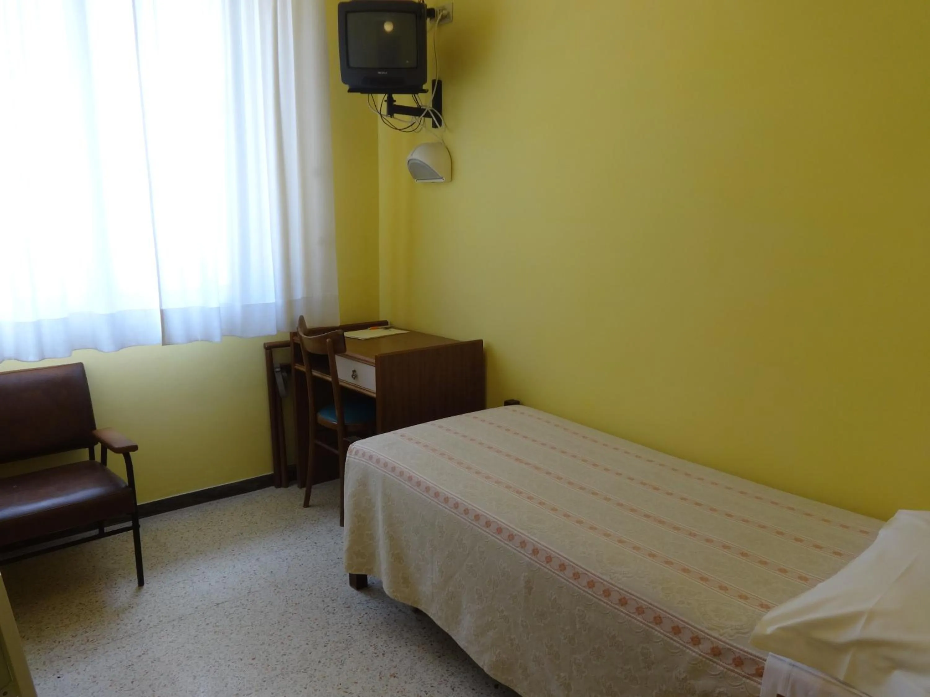 Bed in Hotel Saturno