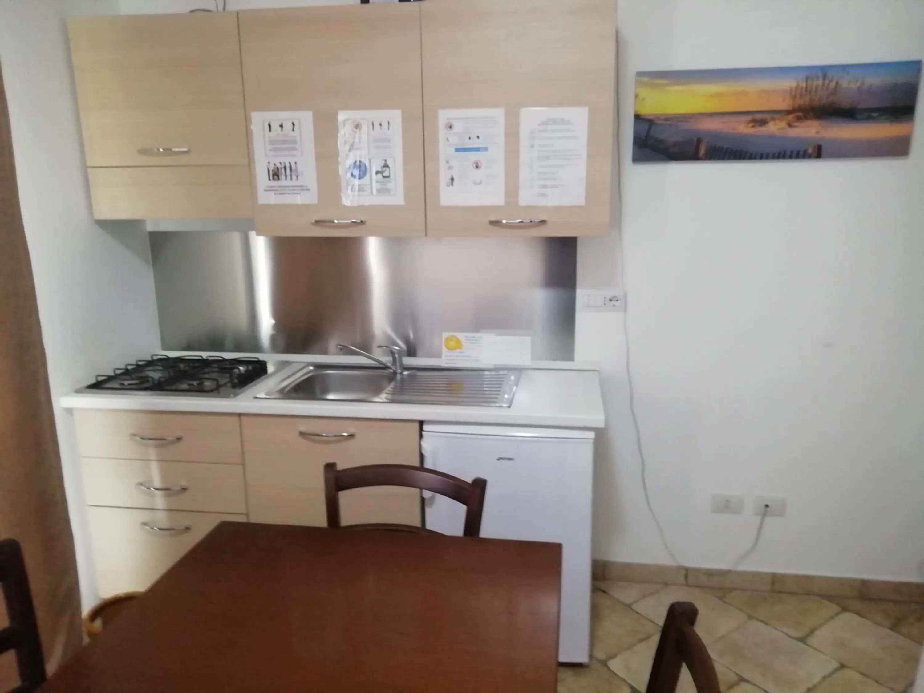 Kitchen or kitchenette in B&B Acquamarina Villasimius