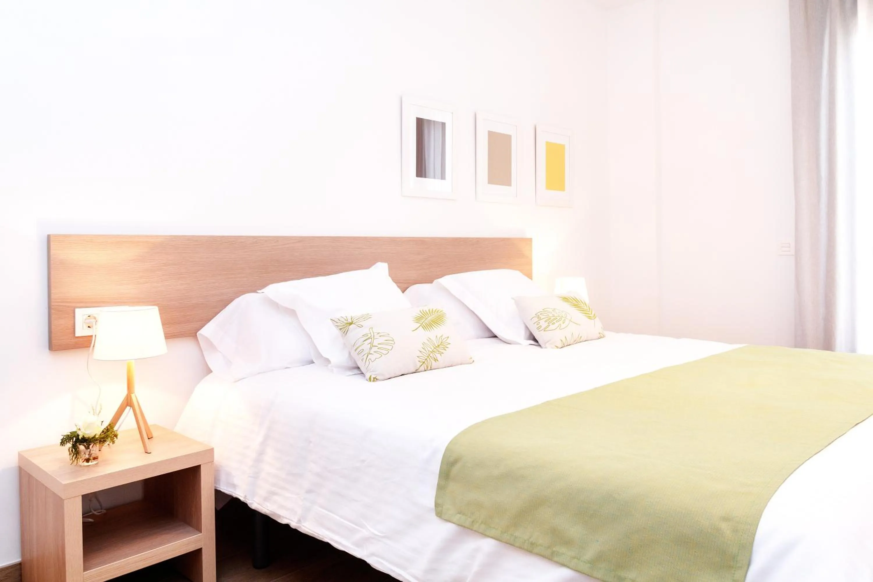 Bed in Feelathome Plaza Apartments
