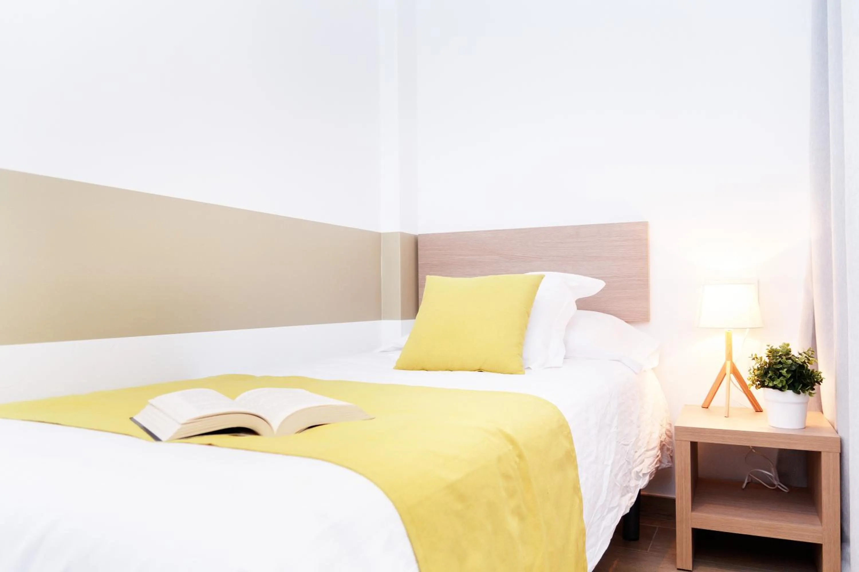 Bed in Feelathome Plaza Apartments