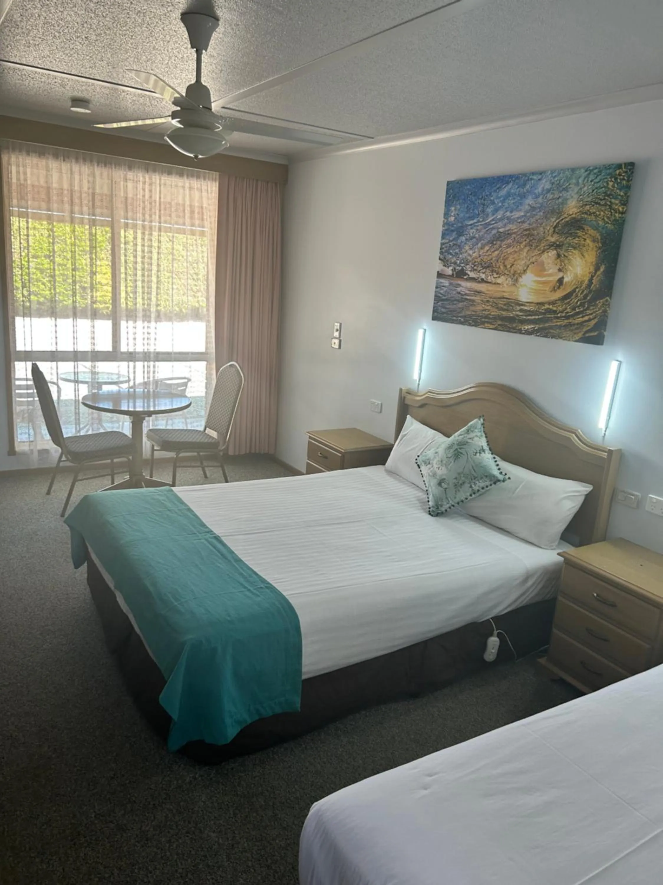 Bed in Acacia Rose Motor Inn