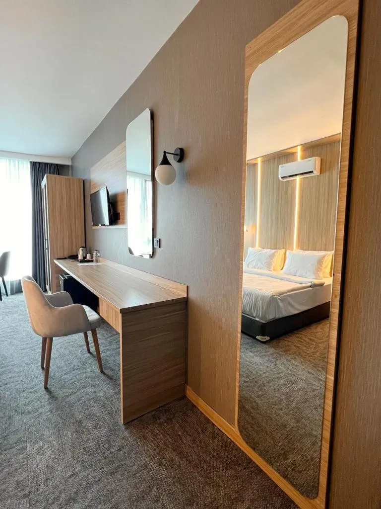 Bed in Royal Mass Airport Business Hotel