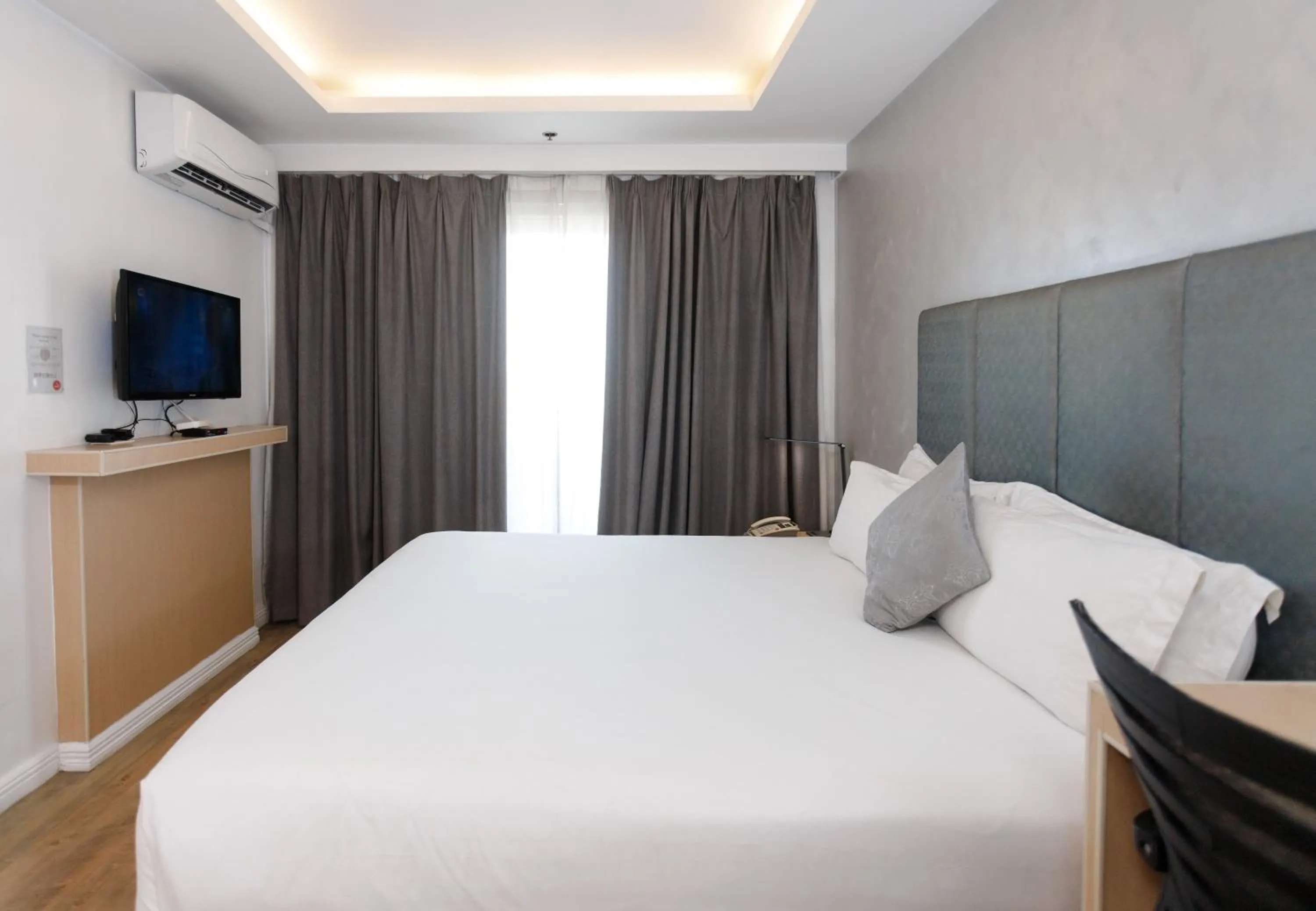 Bed in Regency Grand Suites