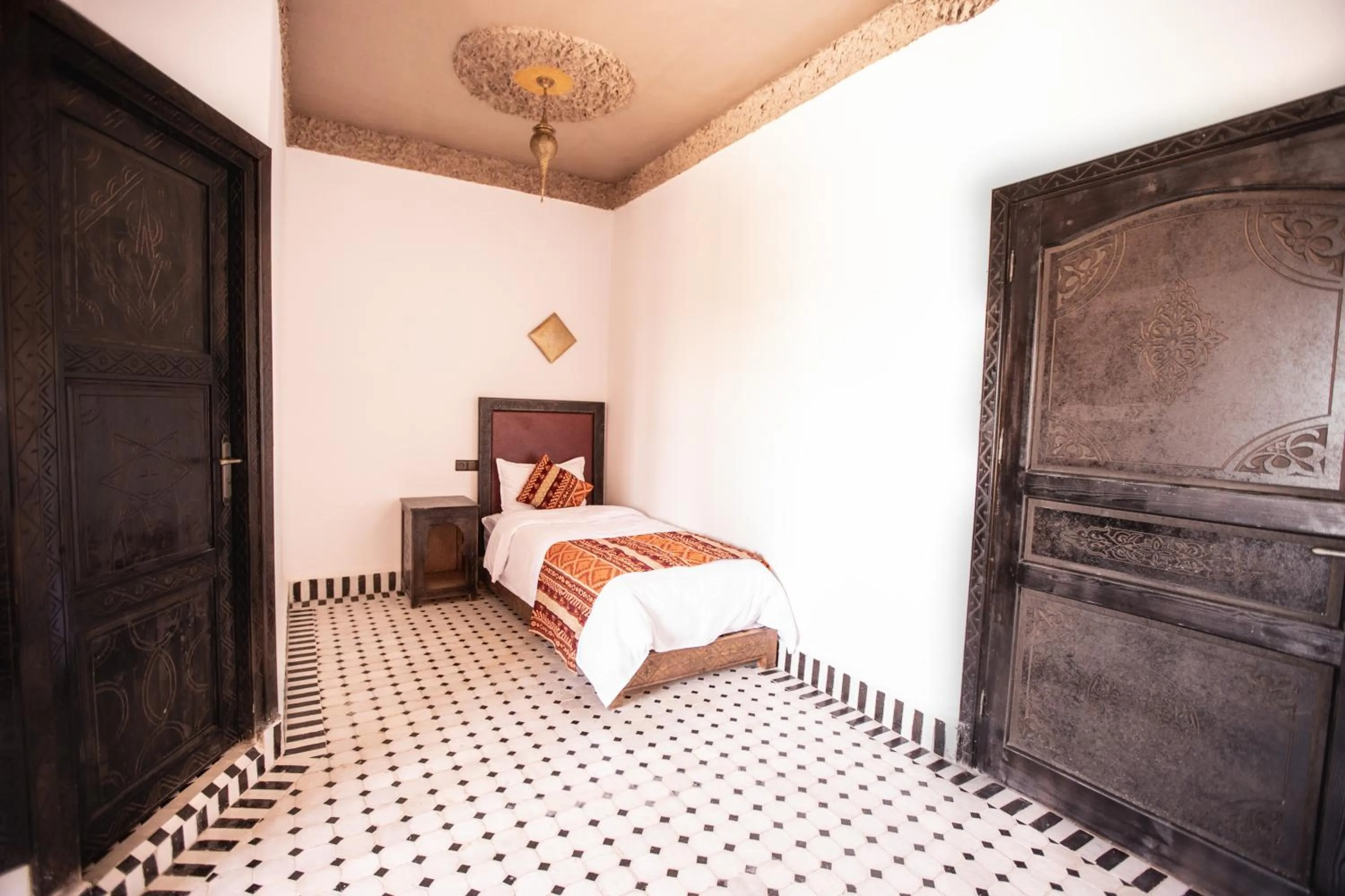 Bed in Riad Merzouga Dunes