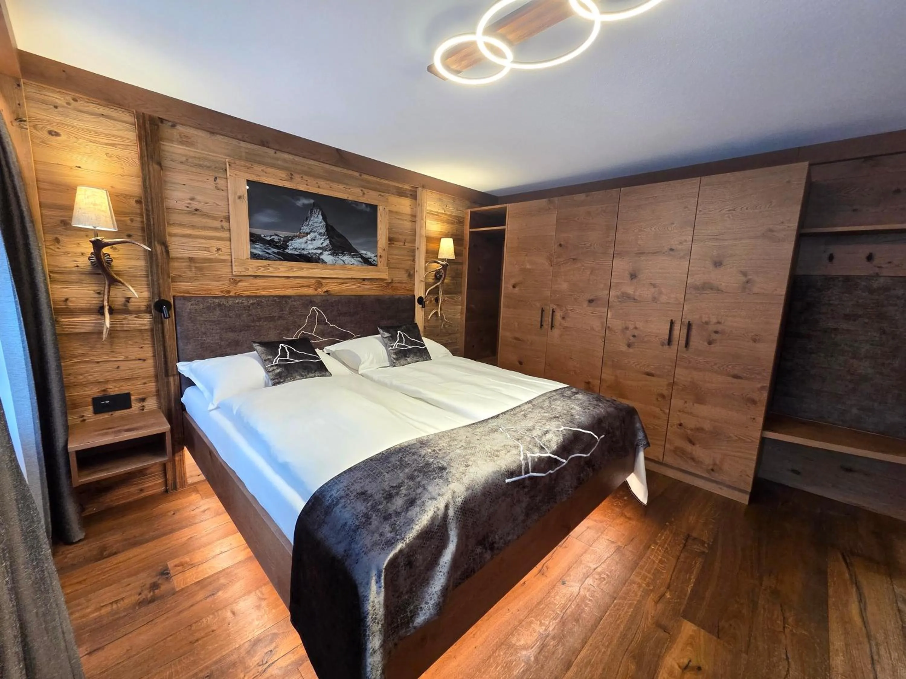 Bed in La Perle Apartments