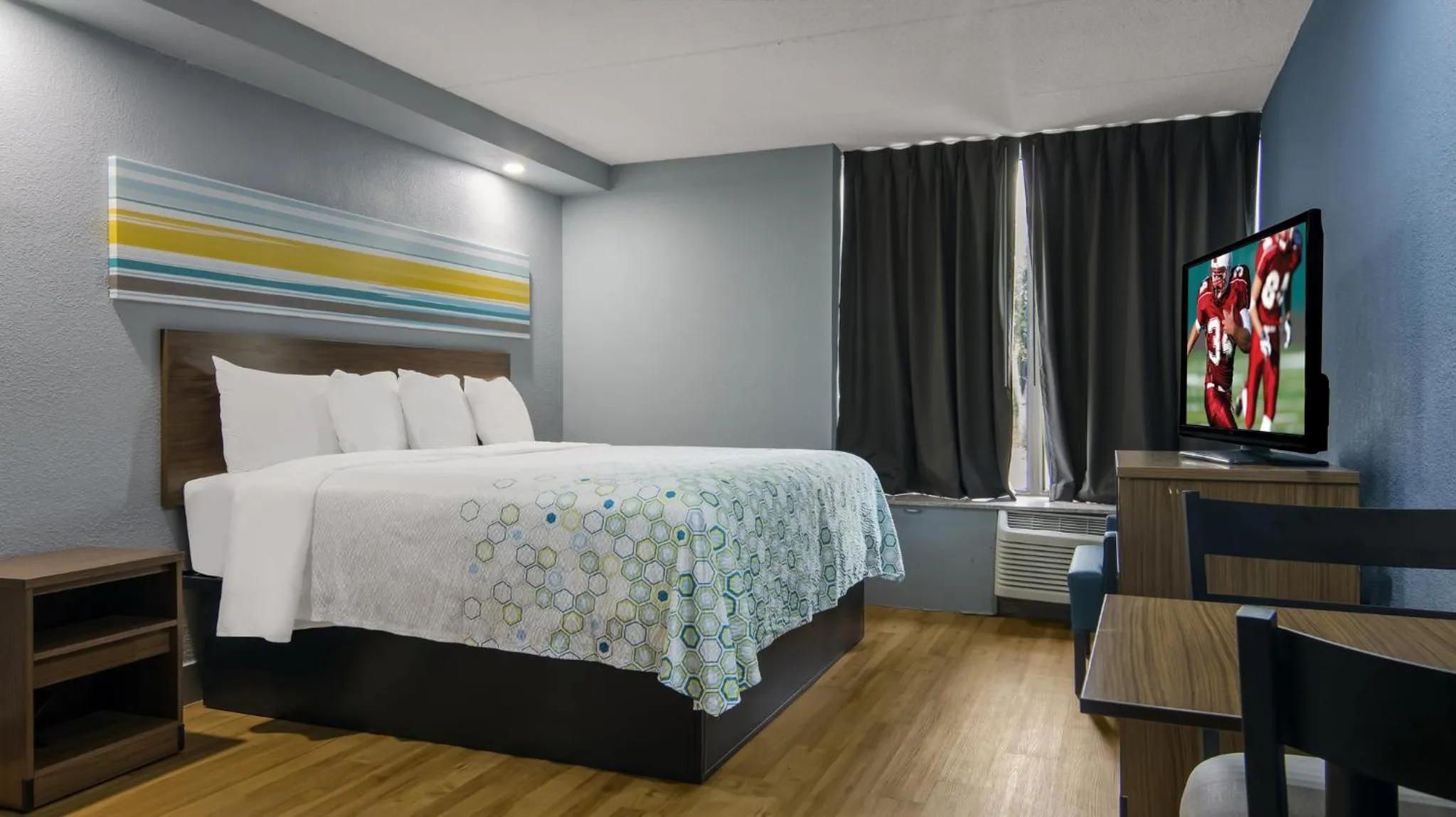 Bedroom, Bed in HomeTowne Studios by Red Roof and Conference Center Chicago - N Aurora Naperville