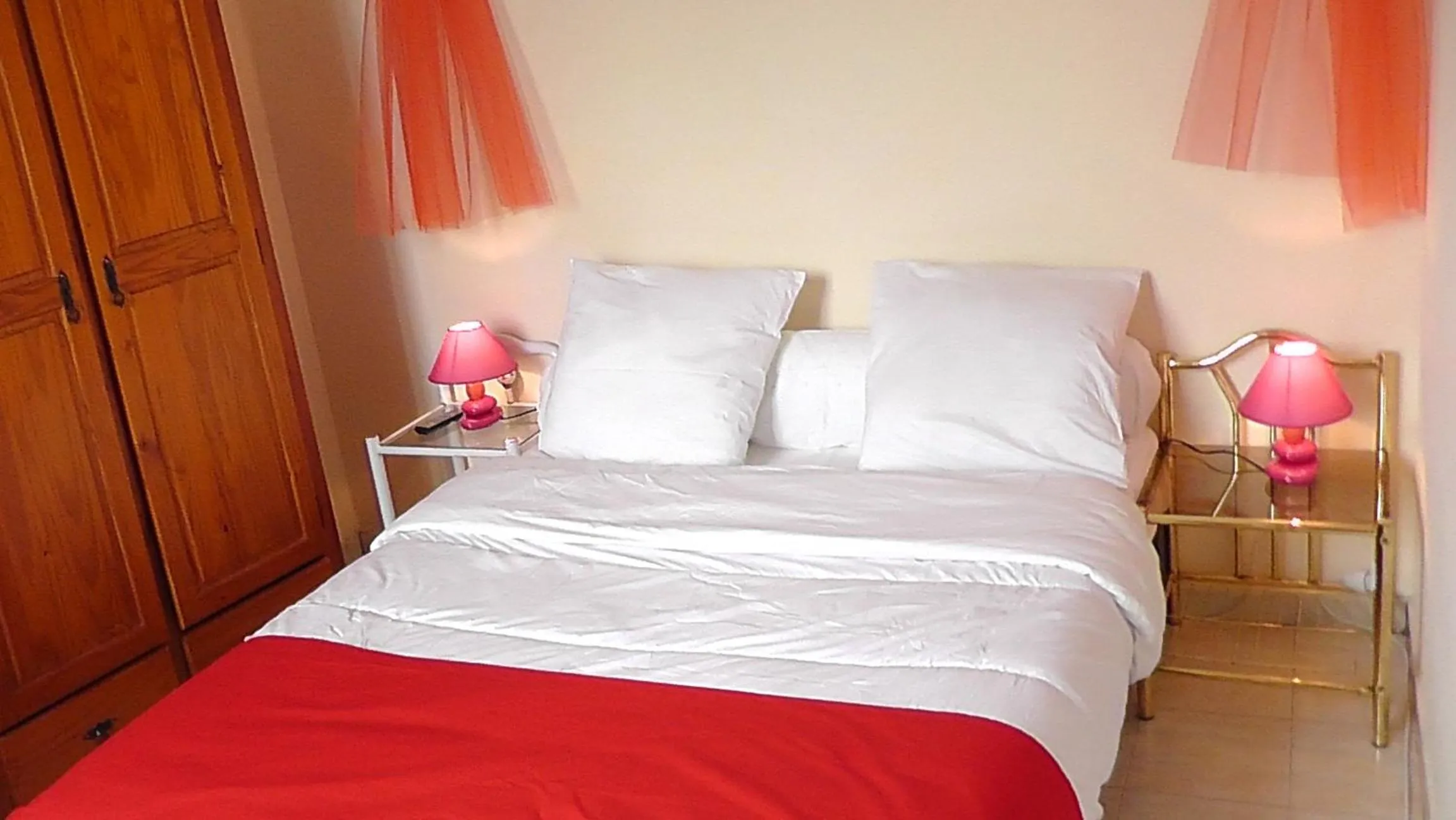 Bed in Hôtel de la Renaissance