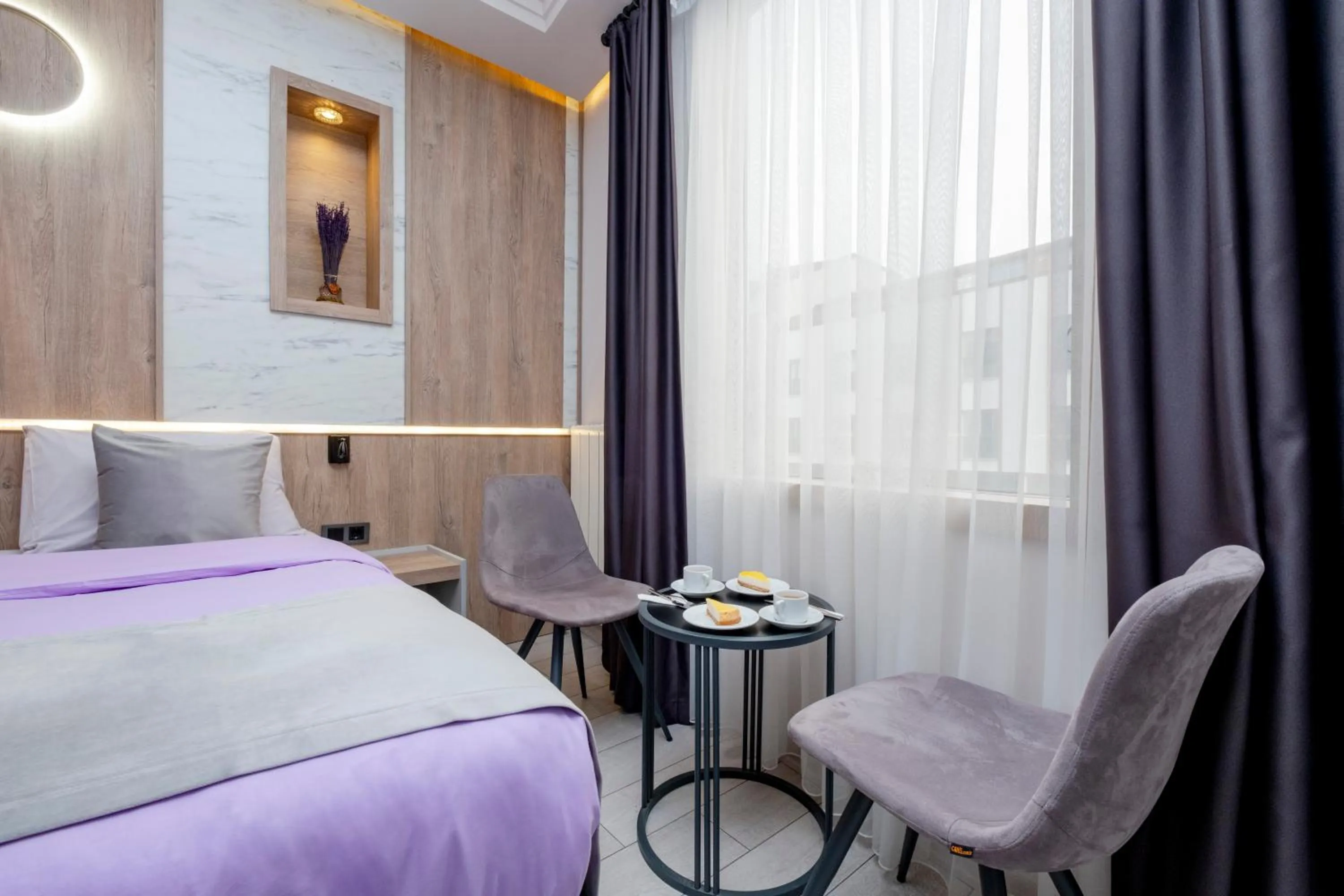 Seating area, Bed in Lavender Airport Hotel