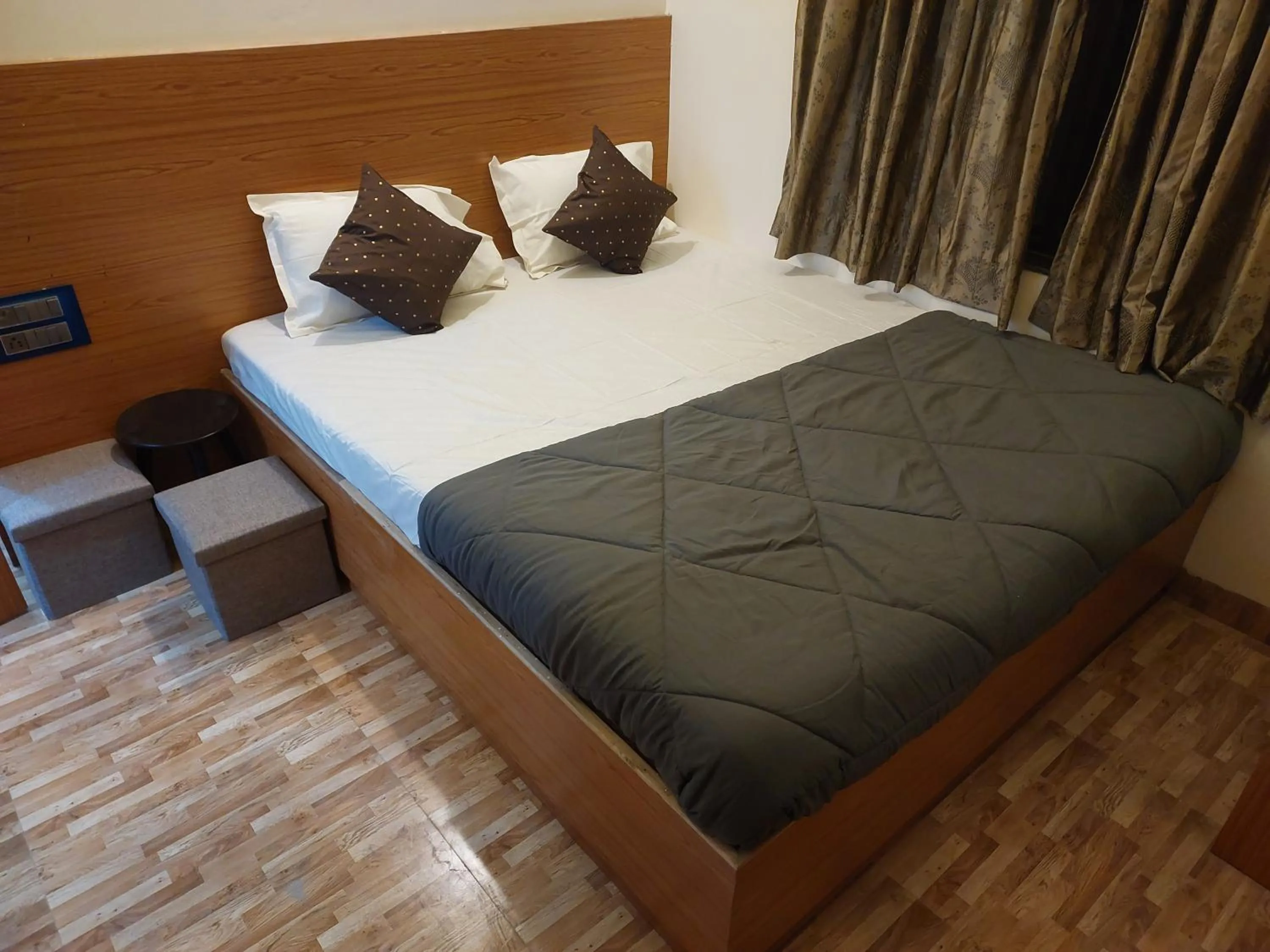 Bed in Hotel Sai Dakshina Inn & The Fern Restaurant