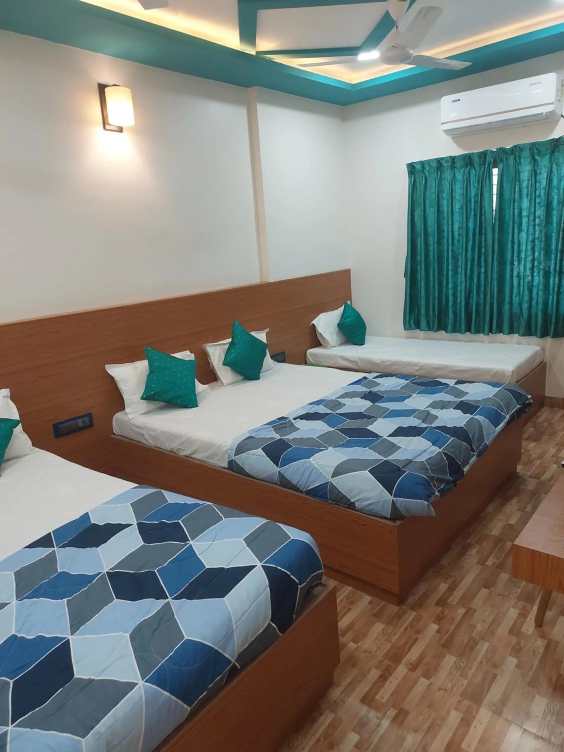 Bed in Hotel Sai Dakshina Inn & The Fern Restaurant