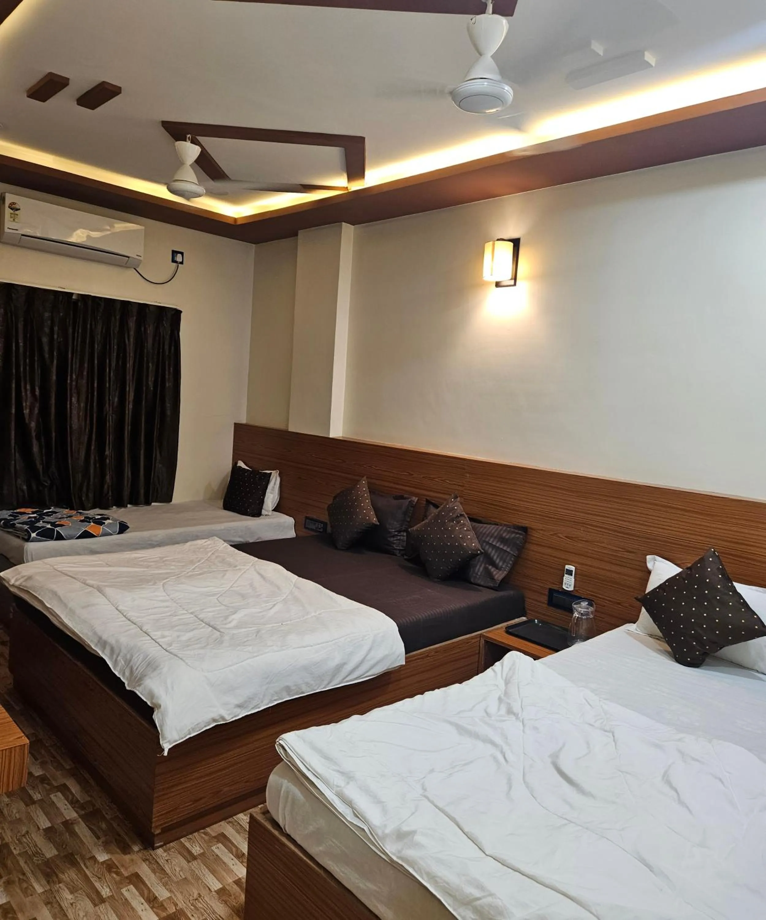 Bed in Hotel Sai Dakshina Inn & The Fern Restaurant