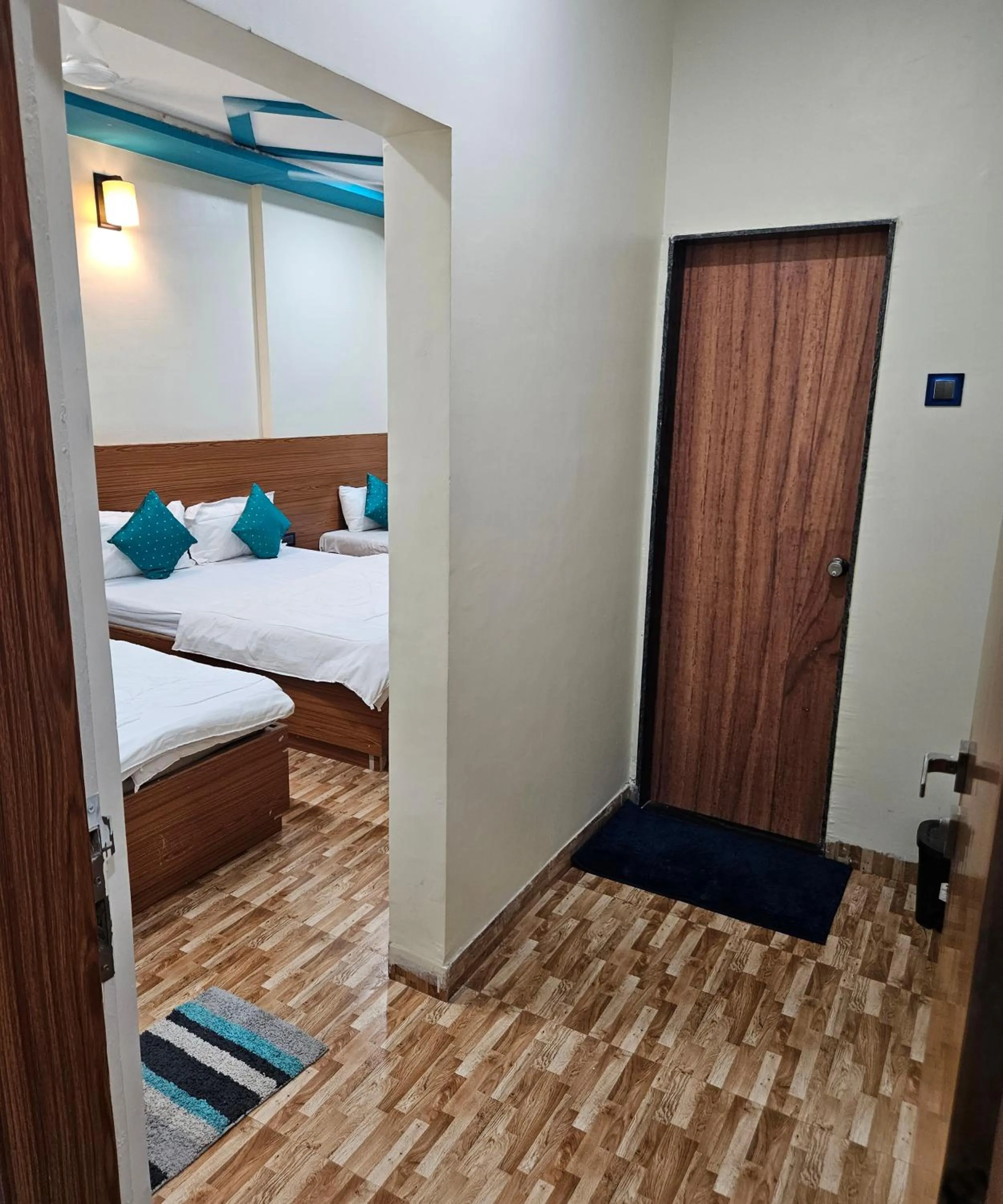 Bed in Hotel Sai Dakshina Inn & The Fern Restaurant