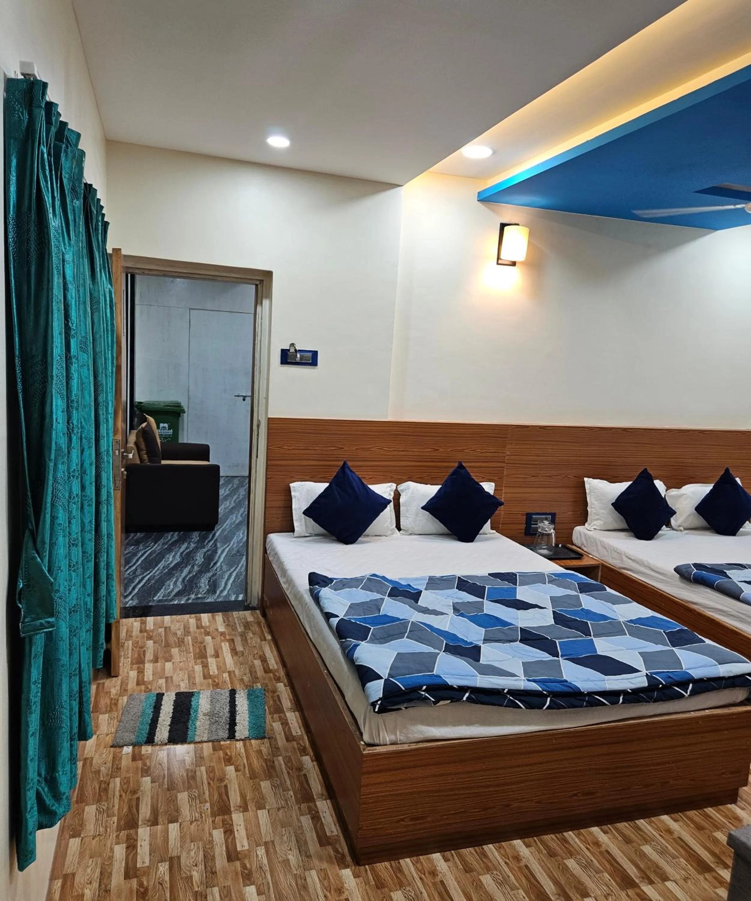 Bed in Hotel Sai Dakshina Inn & The Fern Restaurant