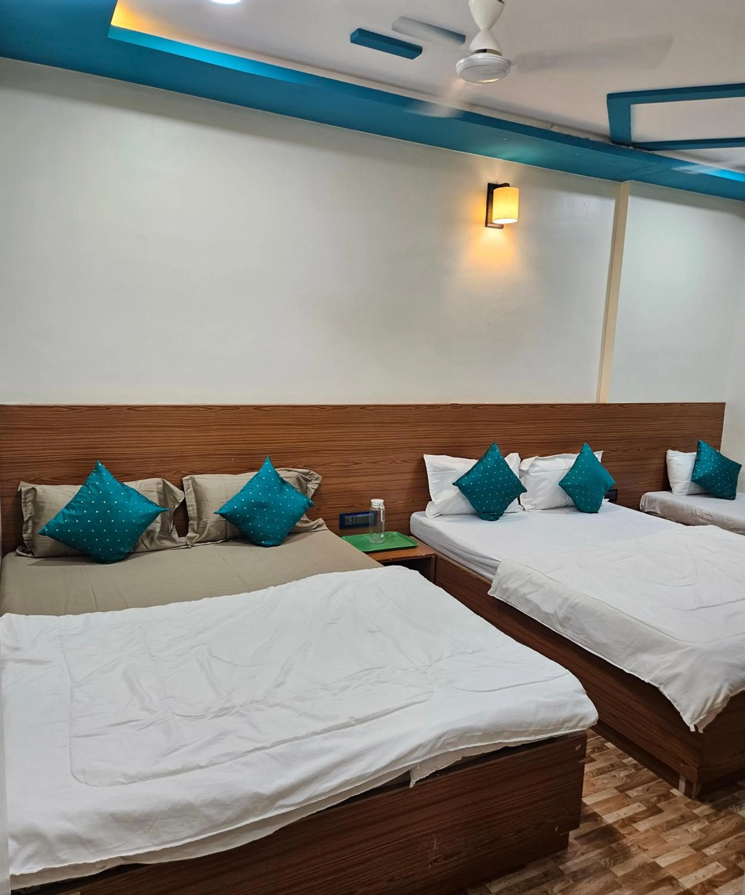 Bed in Hotel Sai Dakshina Inn & The Fern Restaurant