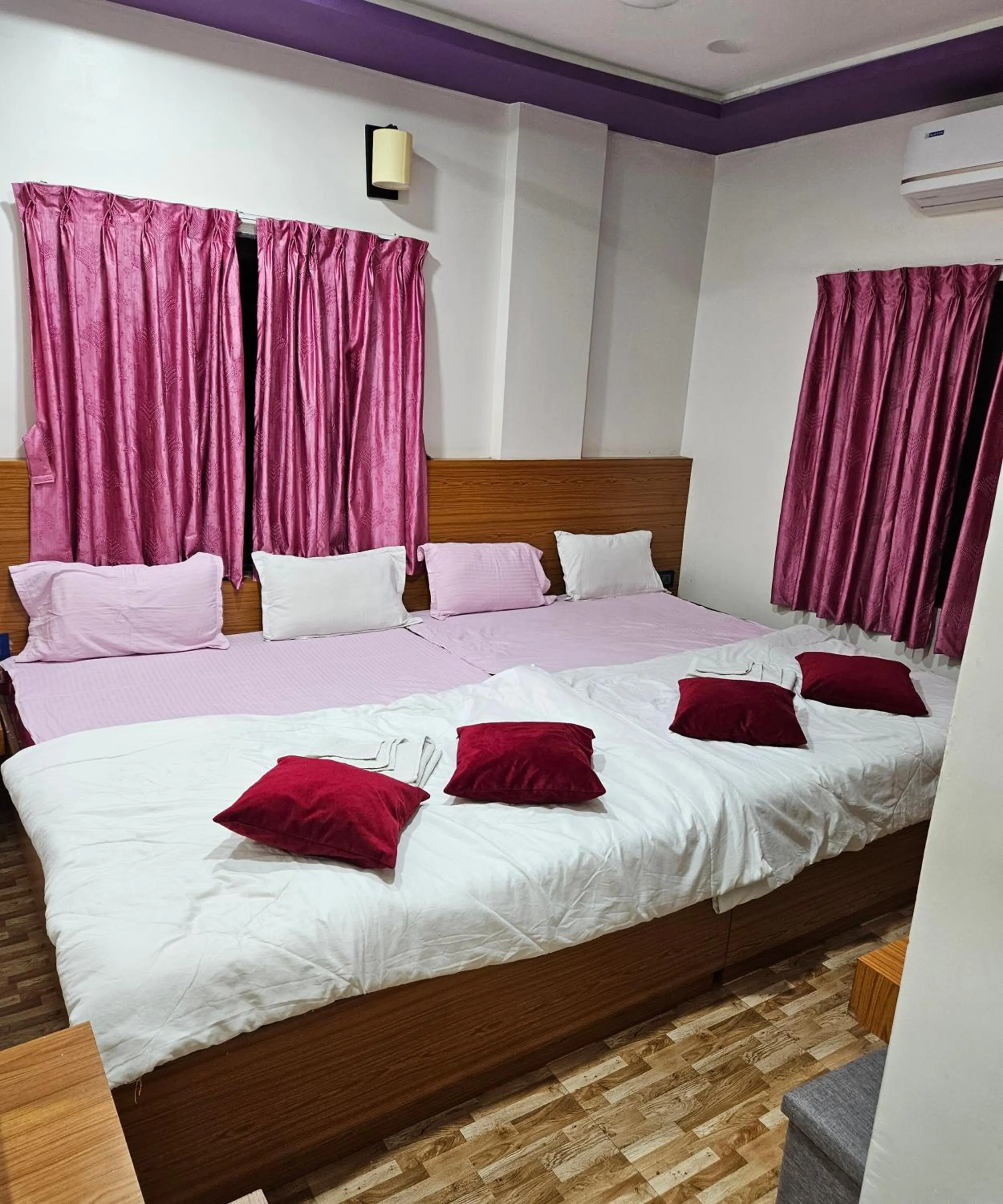 Bed in Hotel Sai Dakshina Inn & The Fern Restaurant