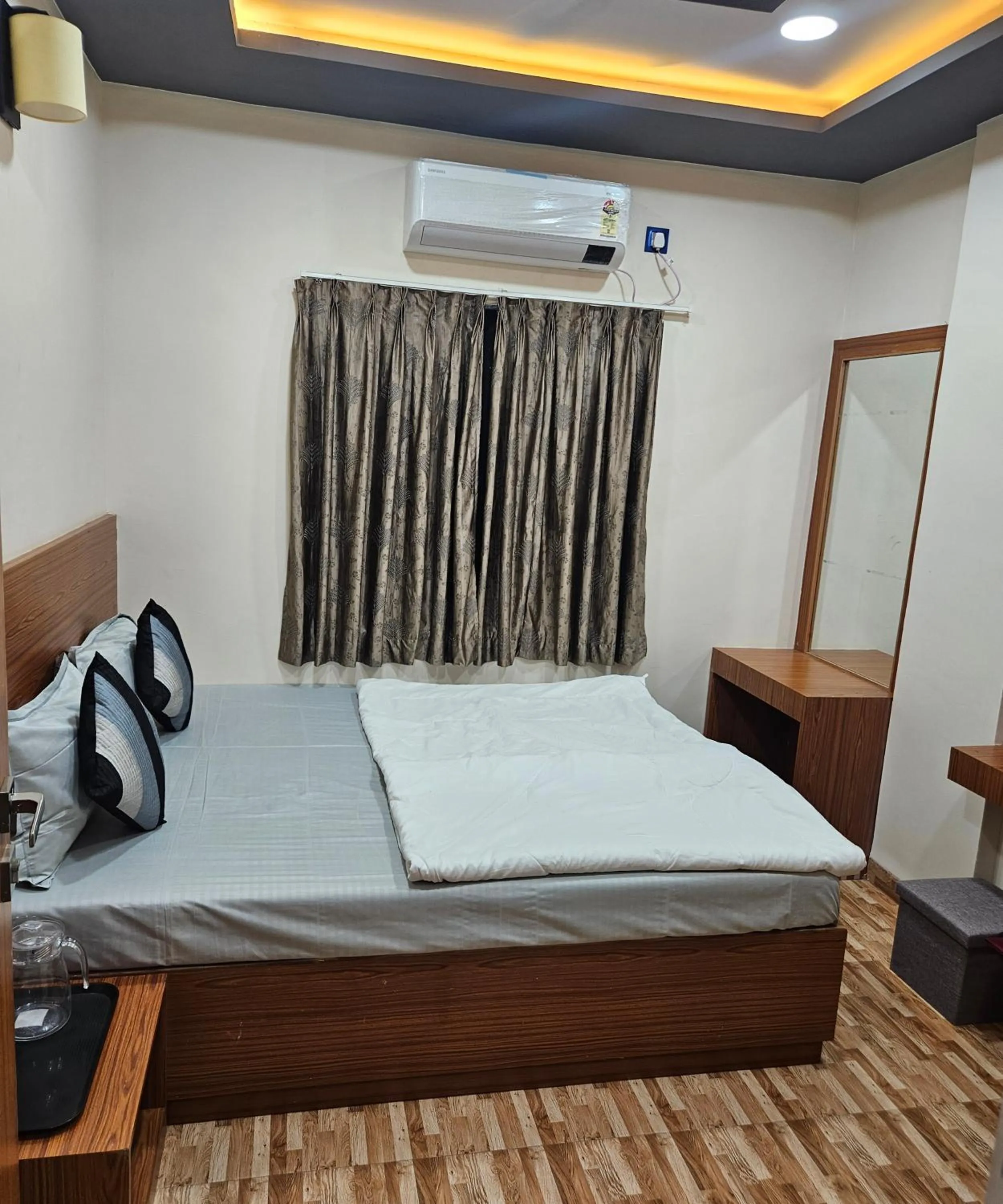 Bed in Hotel Sai Dakshina Inn & The Fern Restaurant