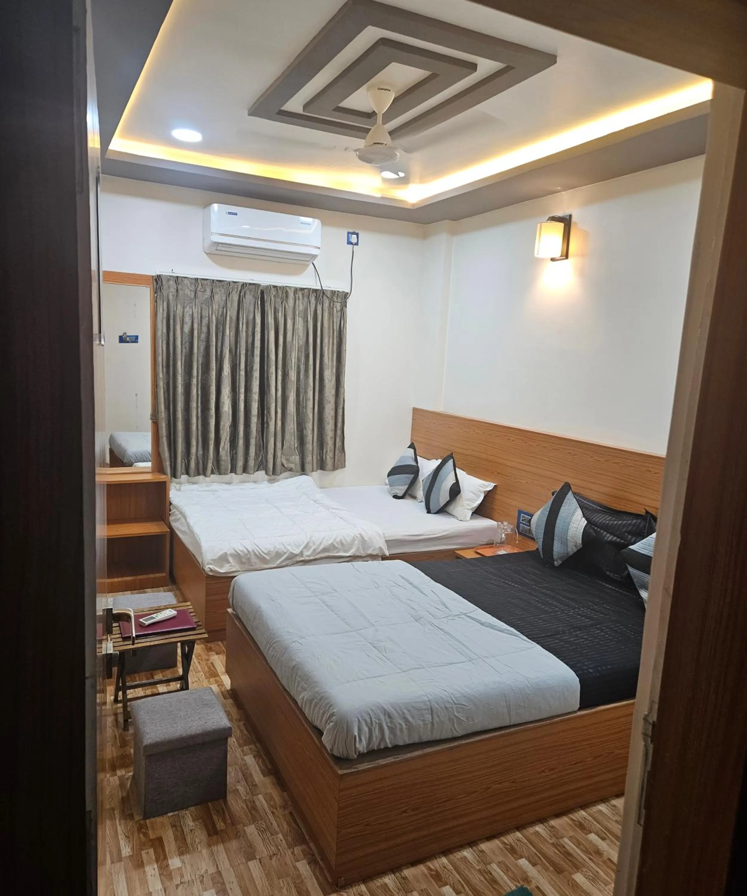 Bed in Hotel Sai Dakshina Inn & The Fern Restaurant