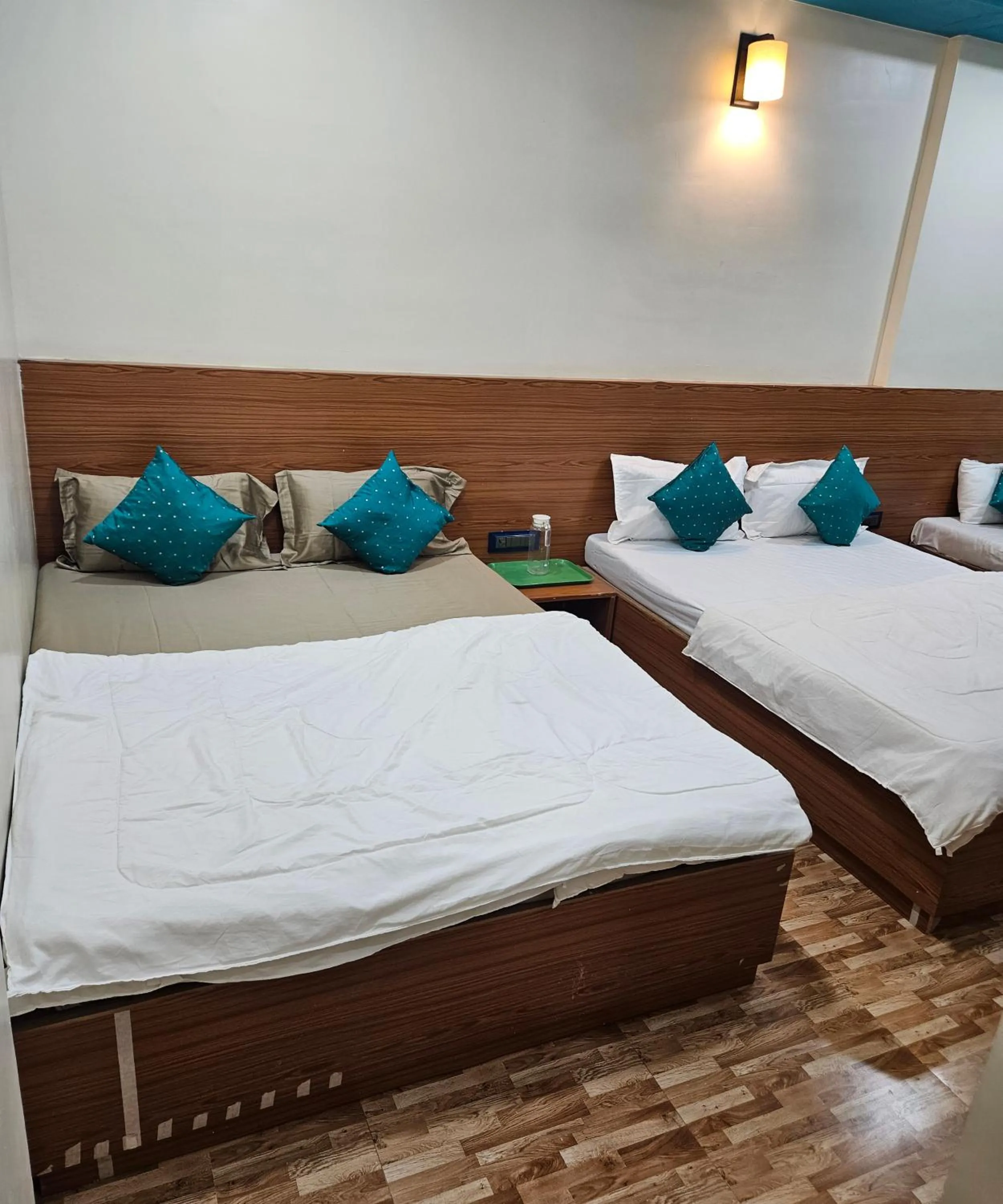 Bed in Hotel Sai Dakshina Inn & The Fern Restaurant