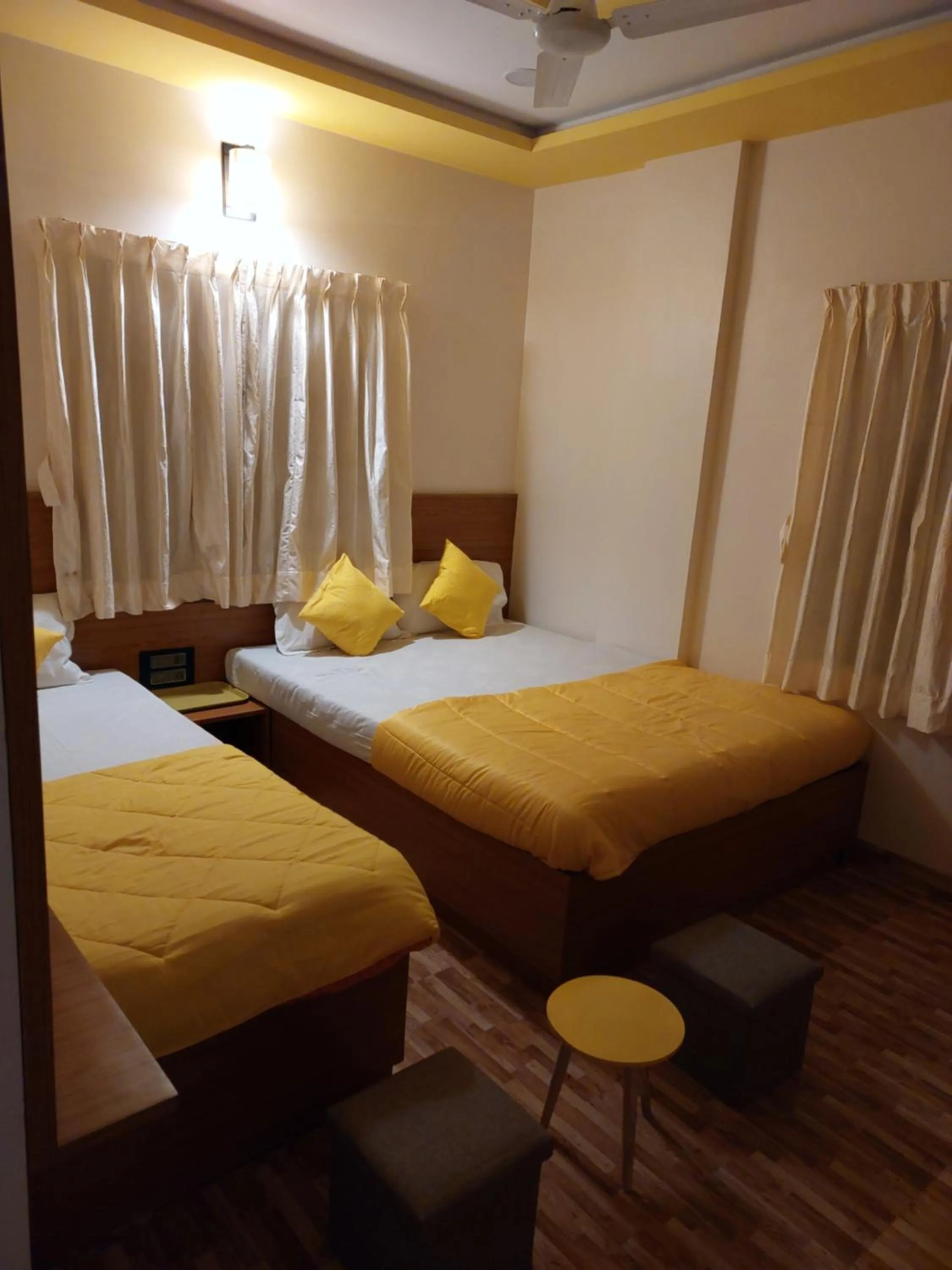 Bed in Hotel Sai Dakshina Inn & The Fern Restaurant