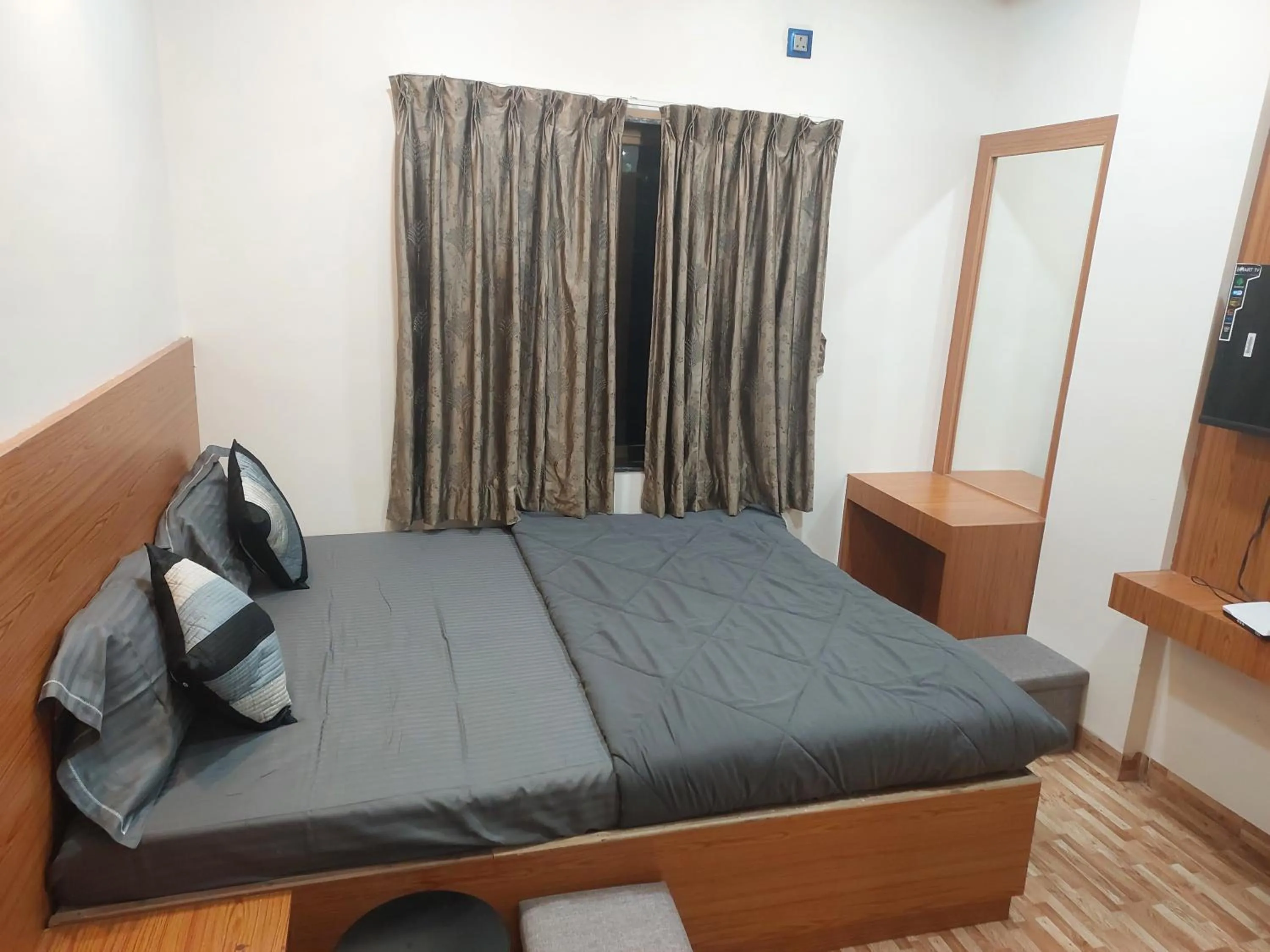 Bed in Hotel Sai Dakshina Inn & The Fern Restaurant