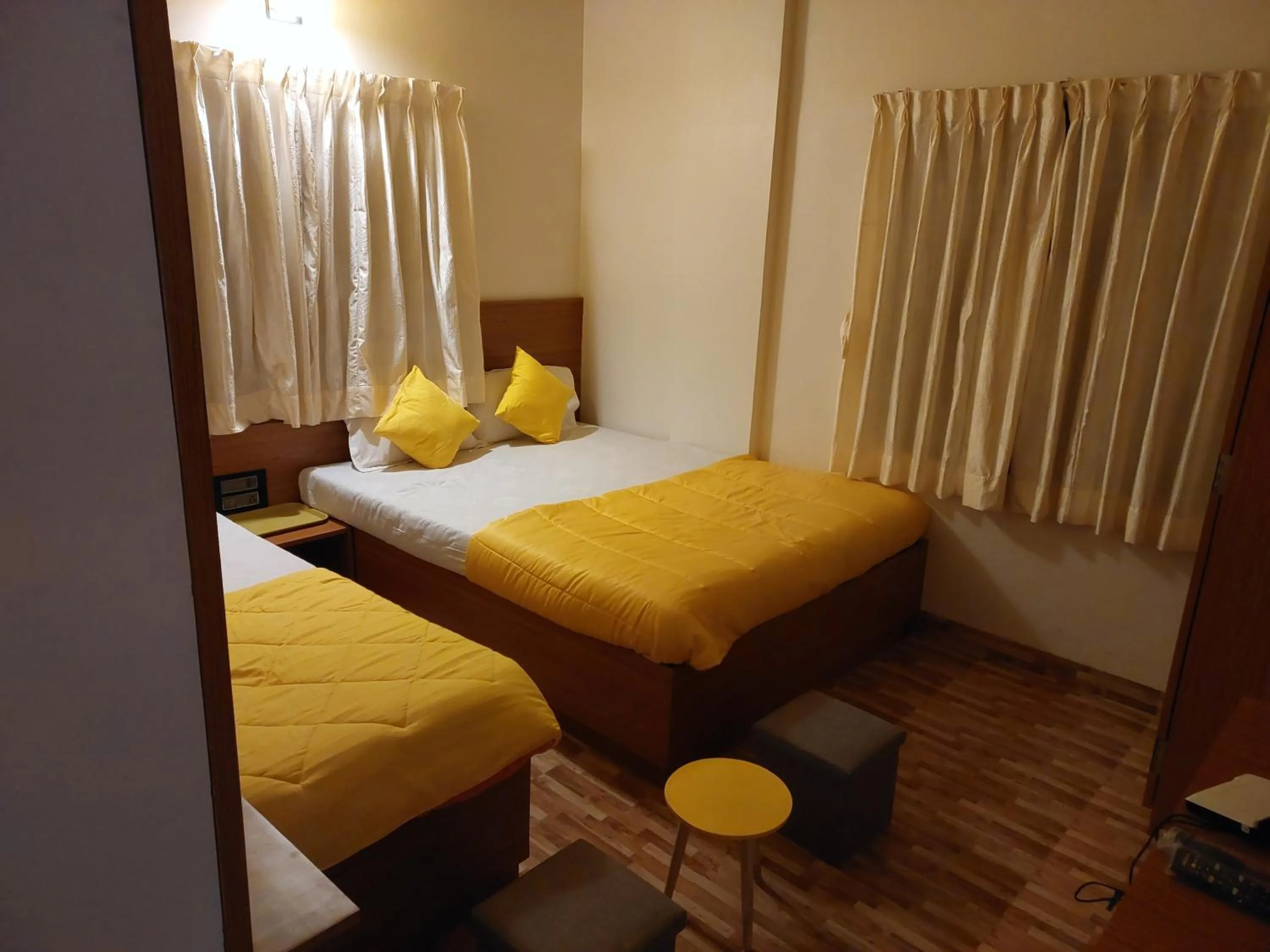 Bed in Hotel Sai Dakshina Inn & The Fern Restaurant