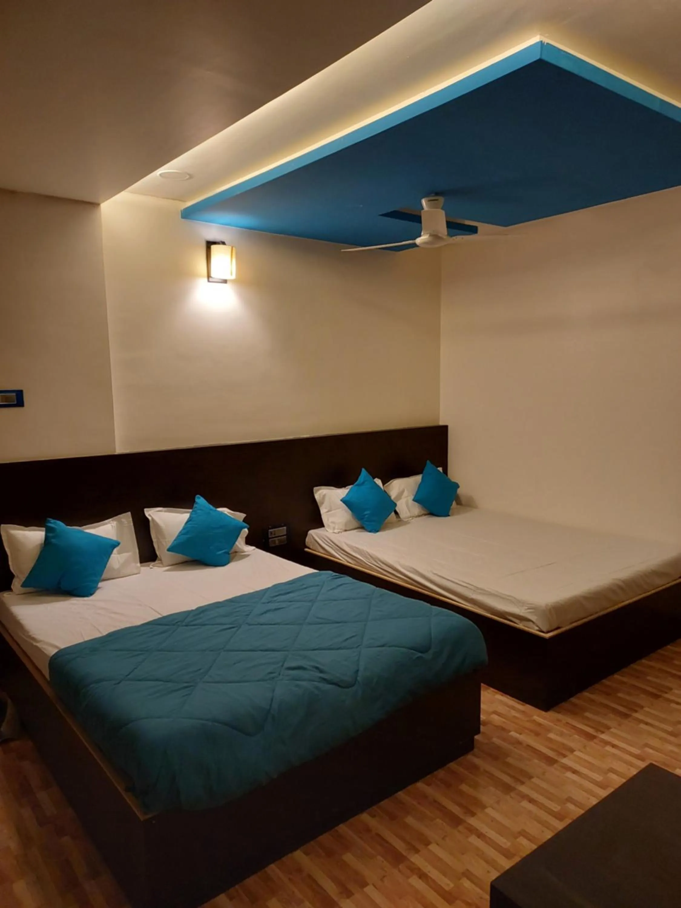 Bed in Hotel Sai Dakshina Inn & The Fern Restaurant