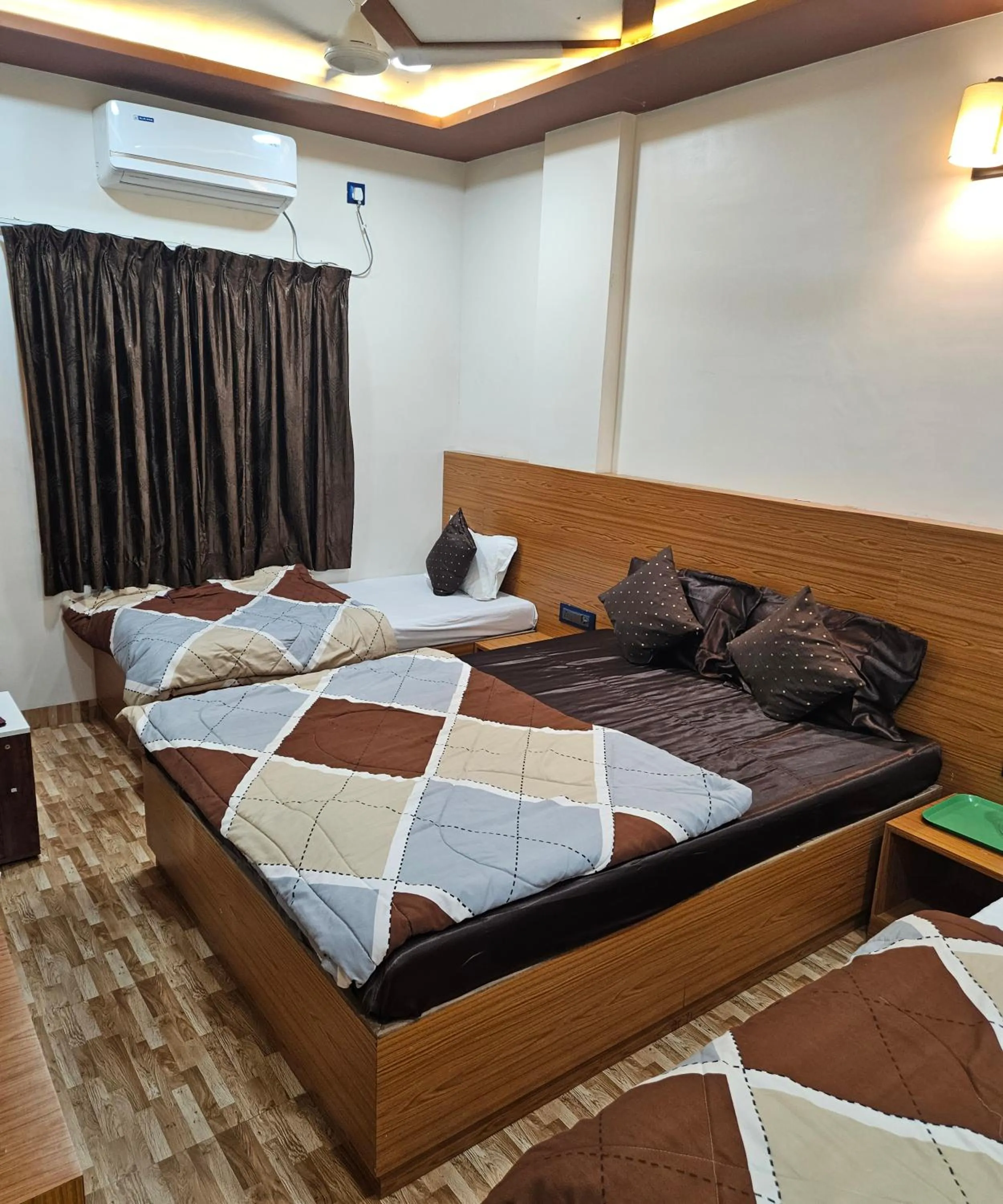 Bed in Hotel Sai Dakshina Inn & The Fern Restaurant