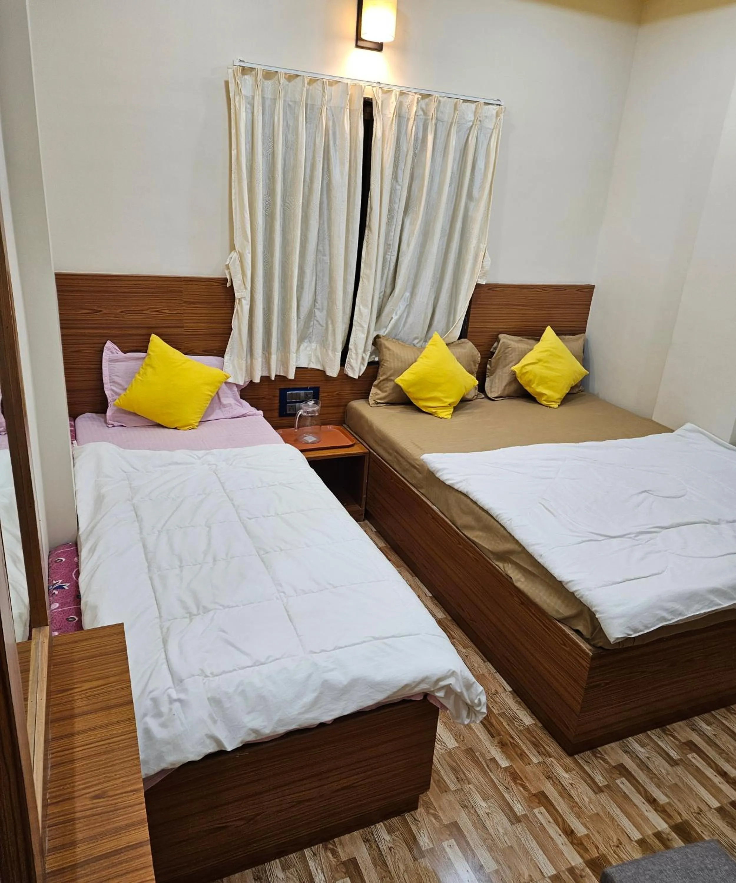 Bed in Hotel Sai Dakshina Inn & The Fern Restaurant