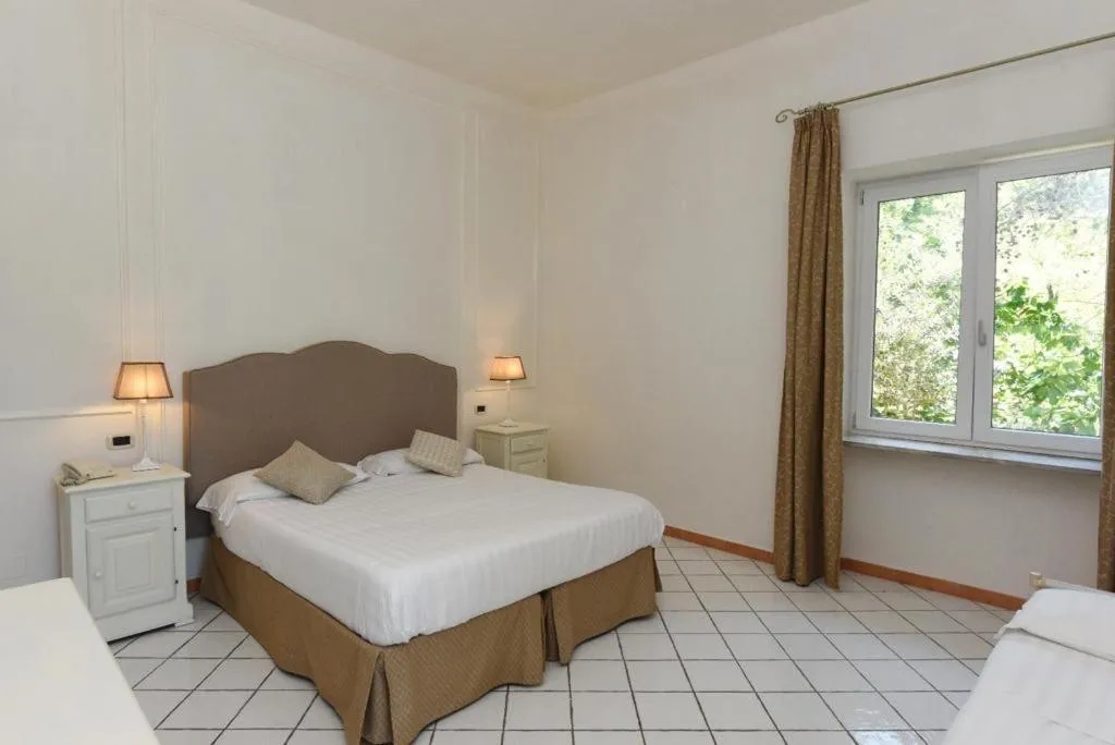 Bed in Hotel Garden Riviera