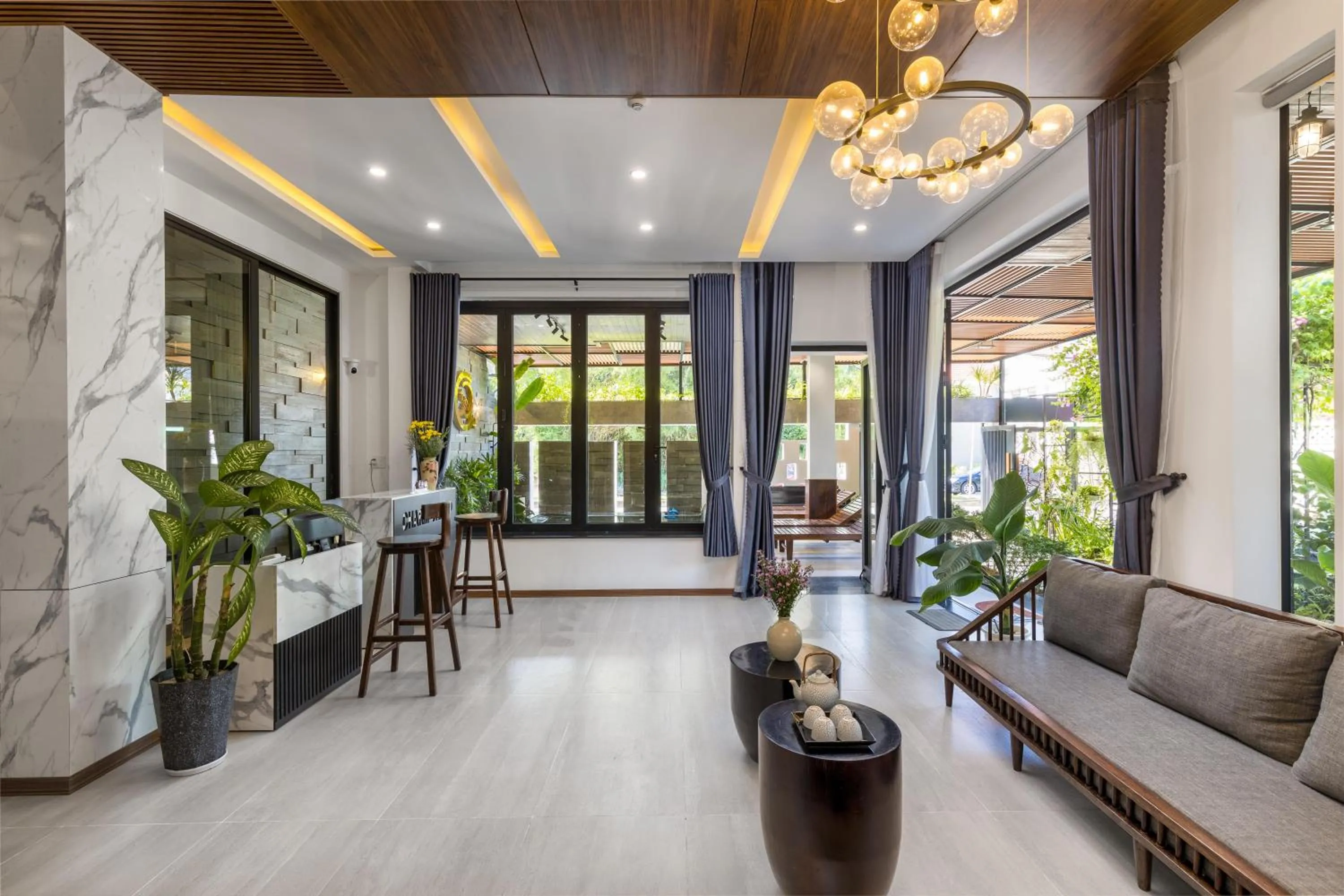 Communal lounge/ TV room in Charm Champion Villa Hoian