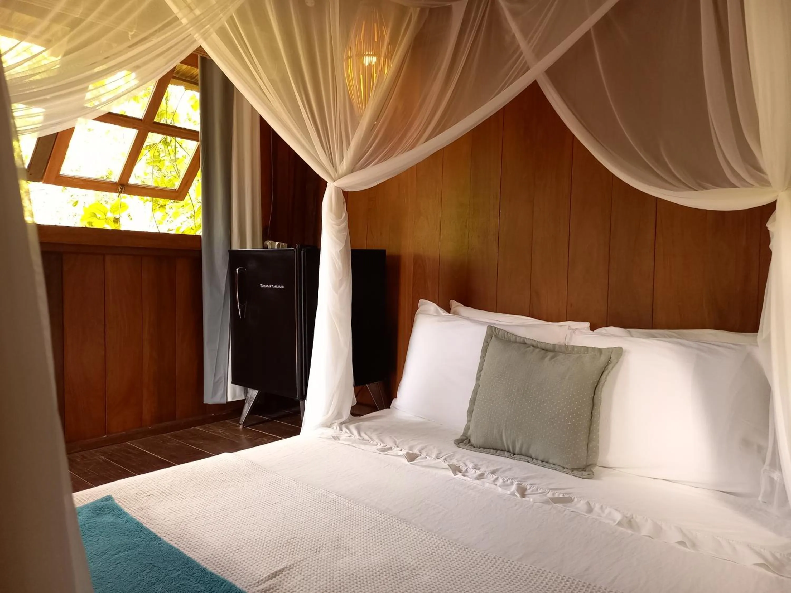 Bed in Bangalôs da Aldeia Caraiva