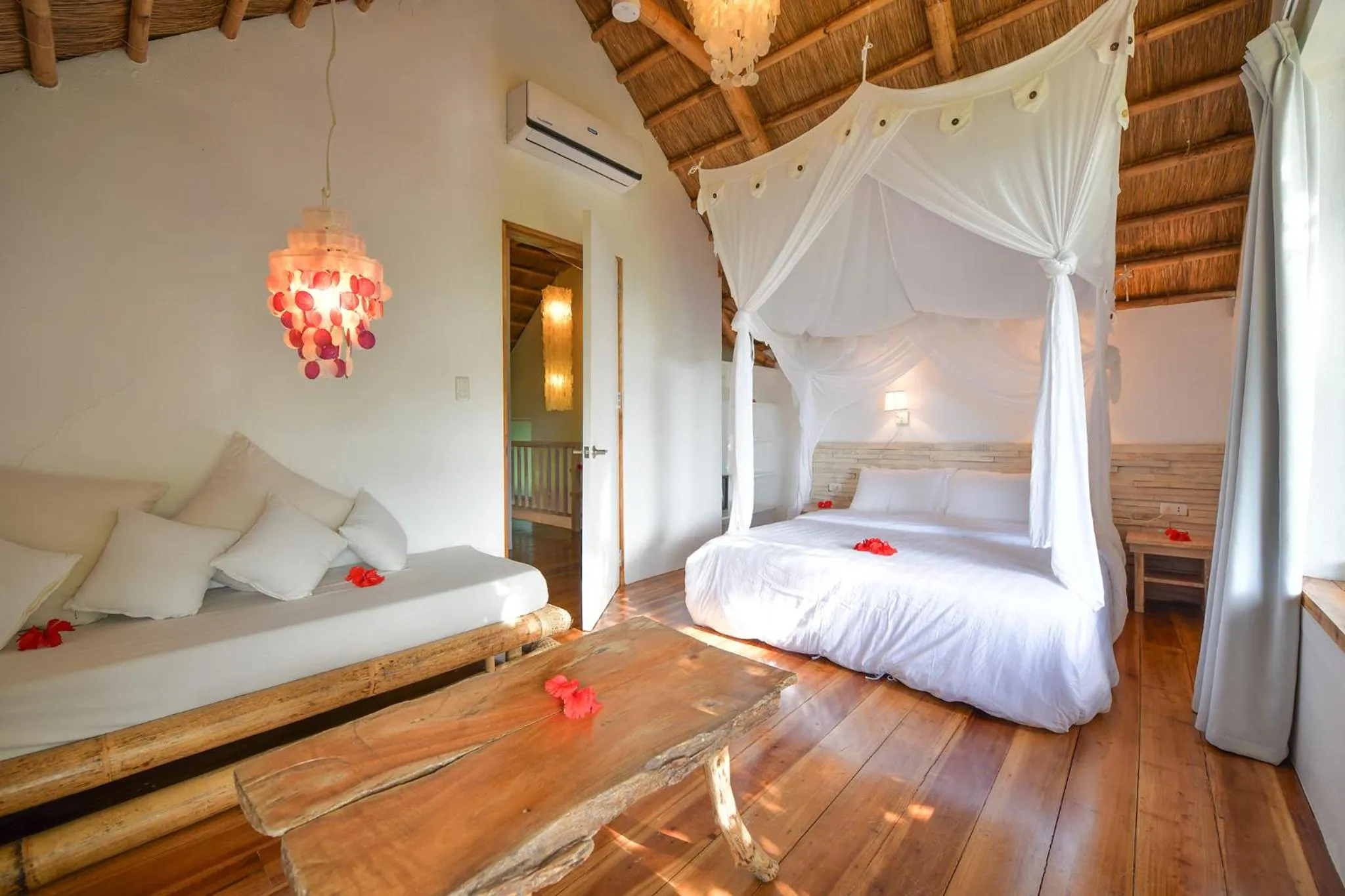 Seating area, Bed in Diniview Villa Resort