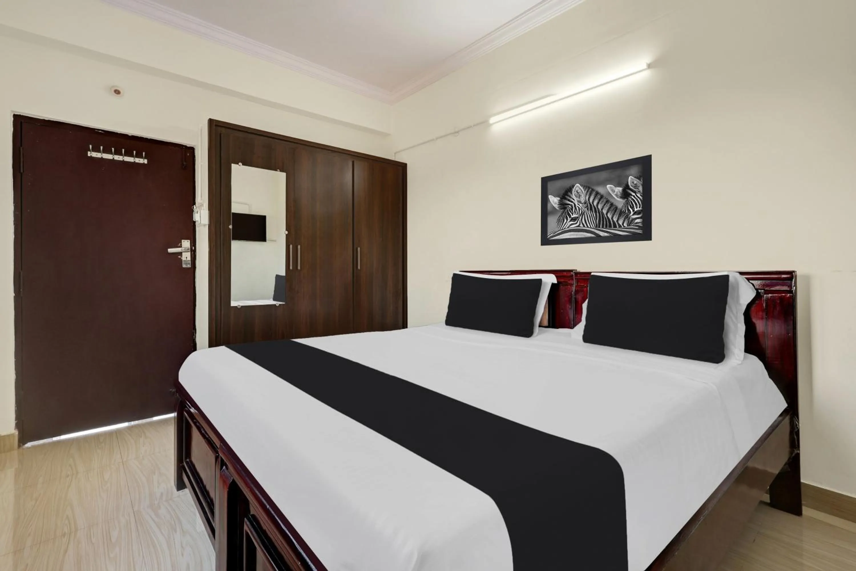 Bedroom, Bed in Super Hotel O Ramaraopet Near Kakinada Beach