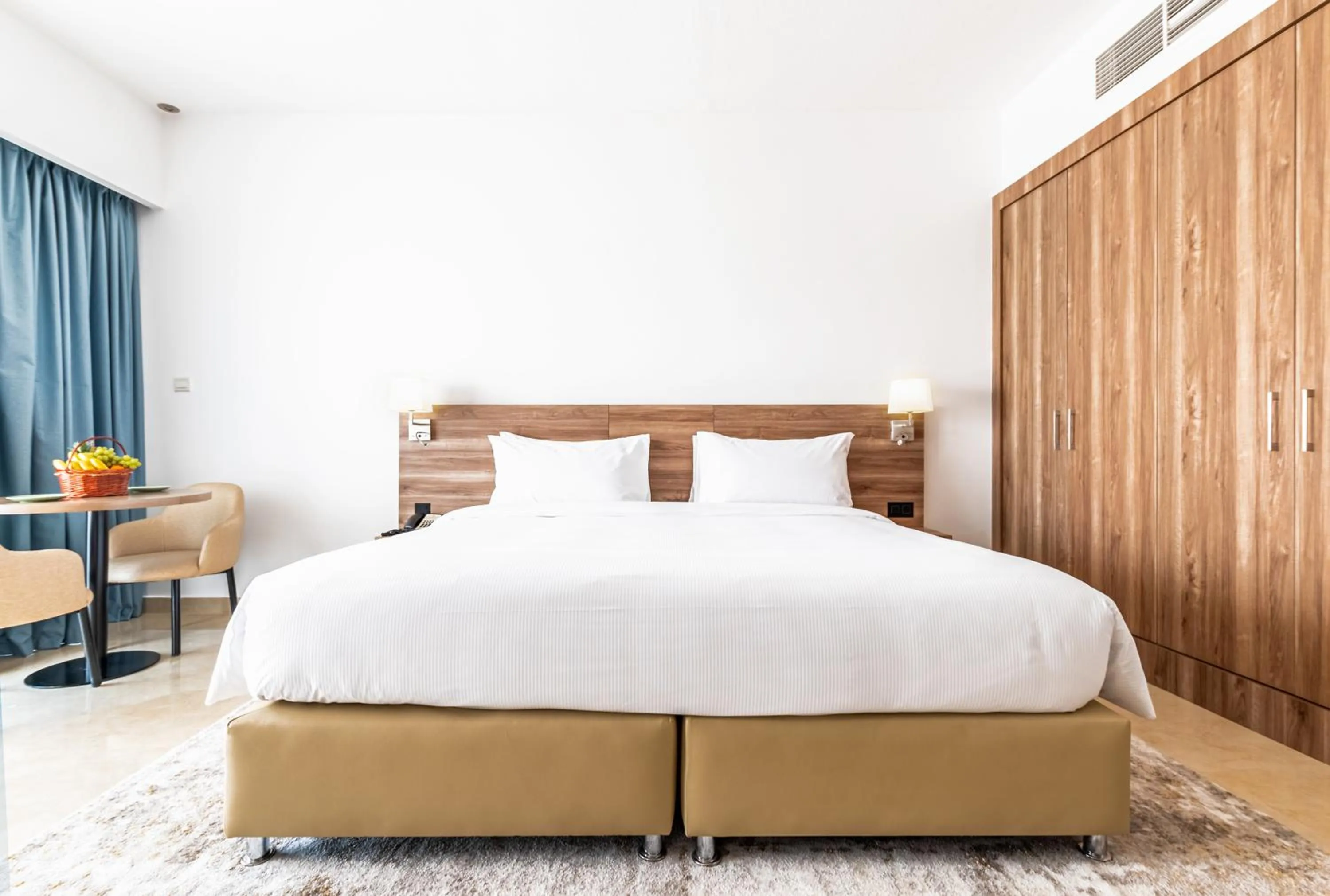 Bed in Pyramisa Hotel Apartments