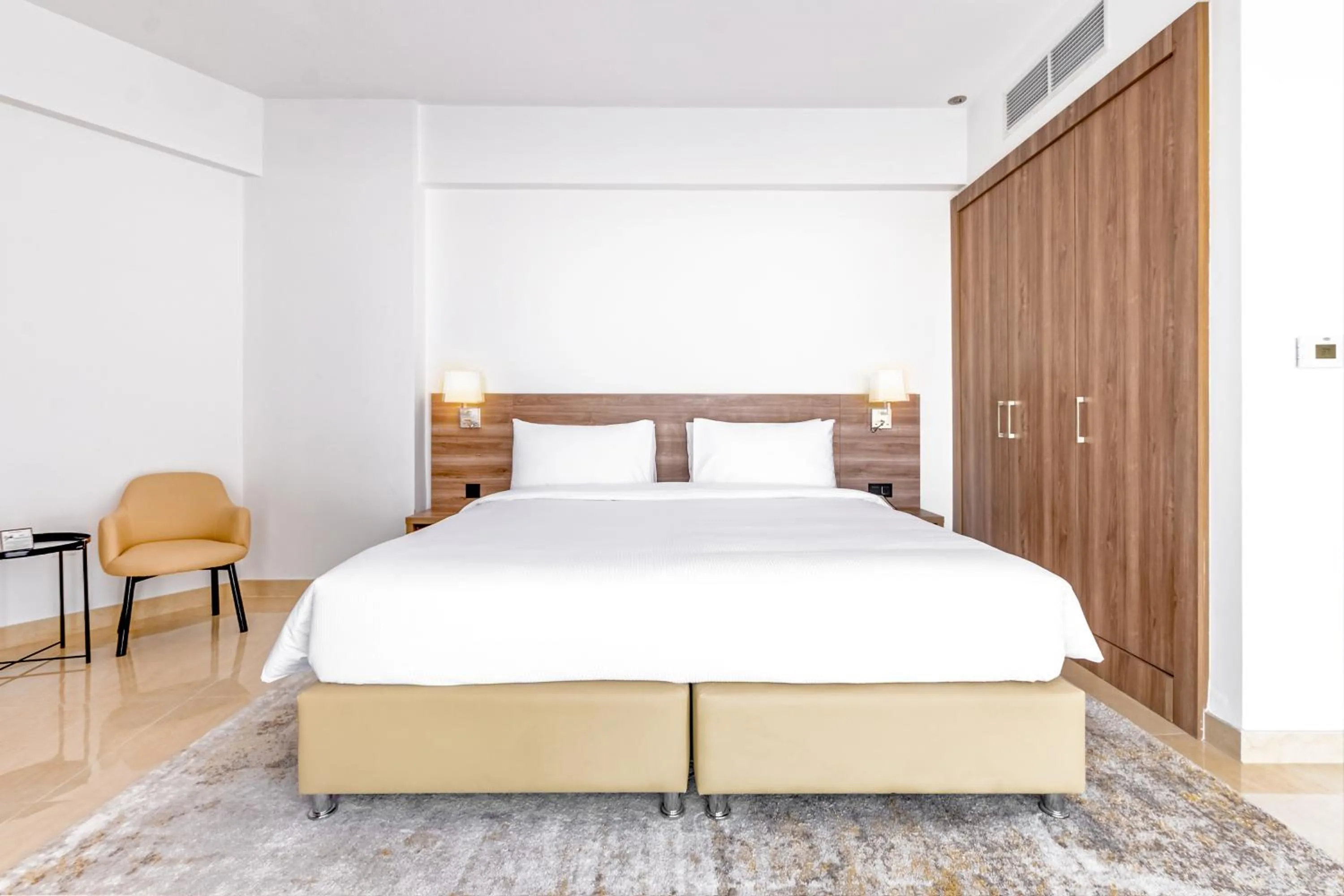 Bed in Pyramisa Hotel Apartments