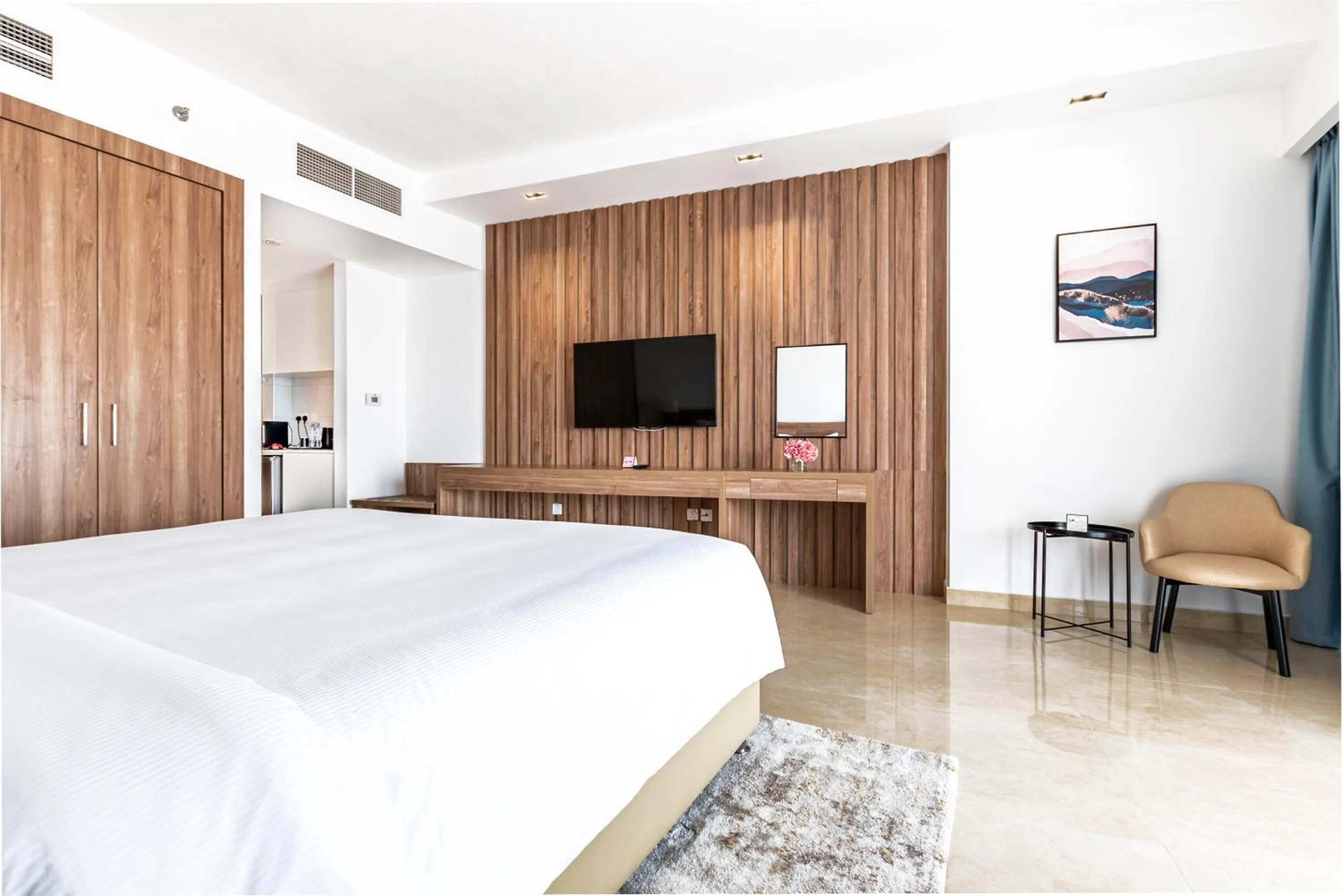 Bed in Pyramisa Hotel Apartments