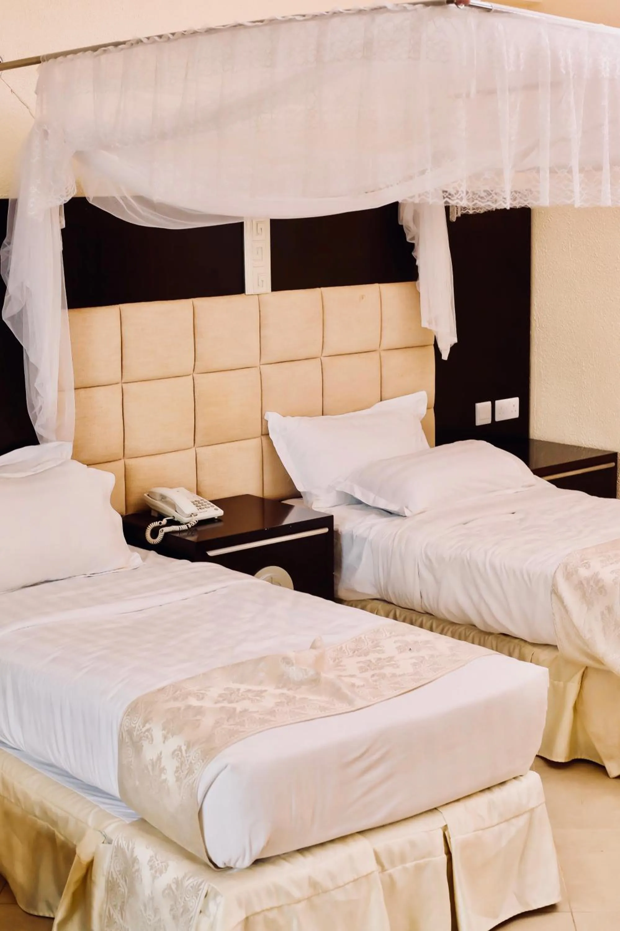Bed in Landmark Mbezi Beach Resort