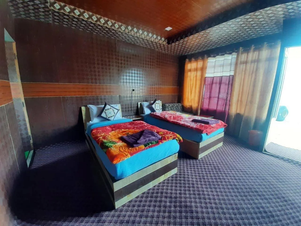 Bed in Soma Retreat Cottage, Pangong Lake