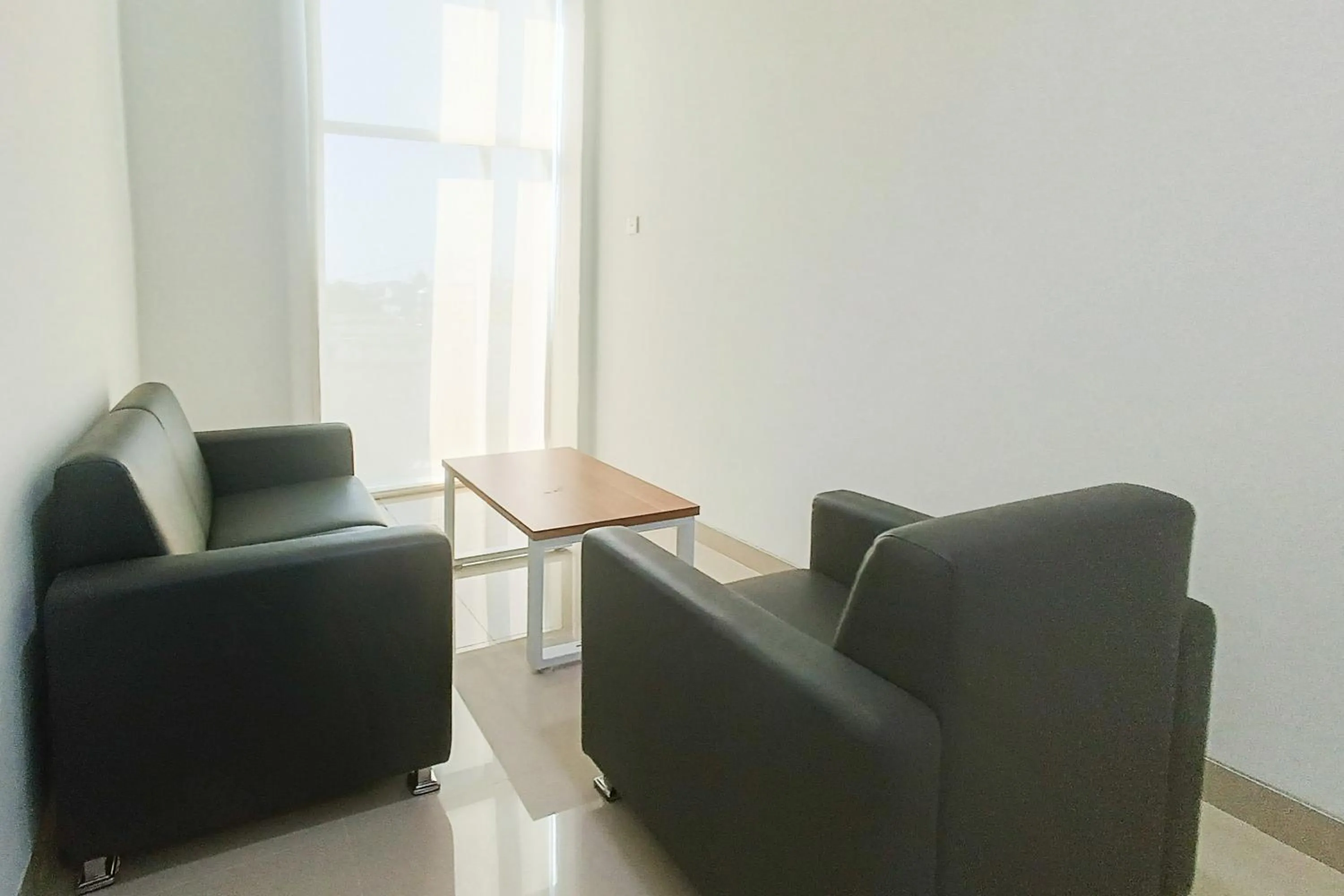 Seating area in Urbanview Hotel Syariah UIN Mataram