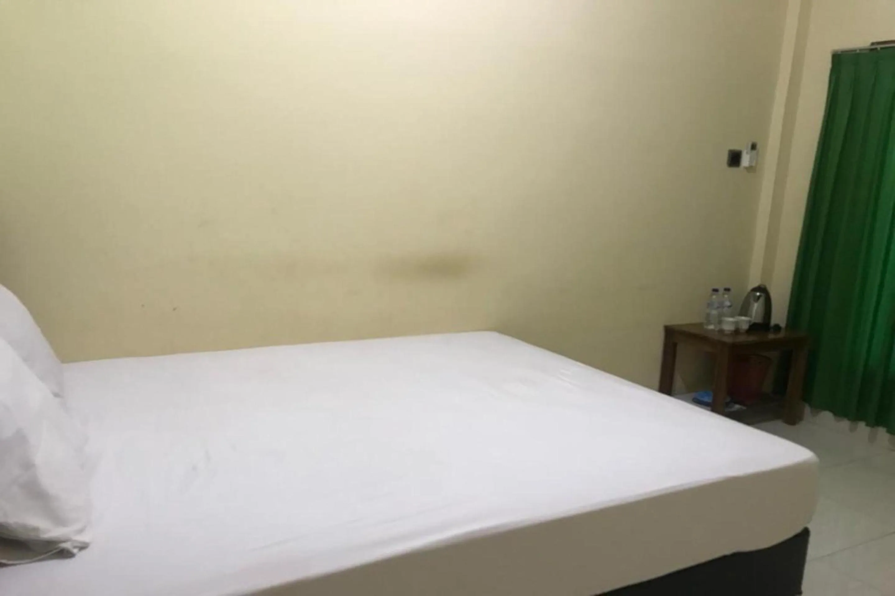 Bedroom in Hotel O Penginapan Mc Lodge