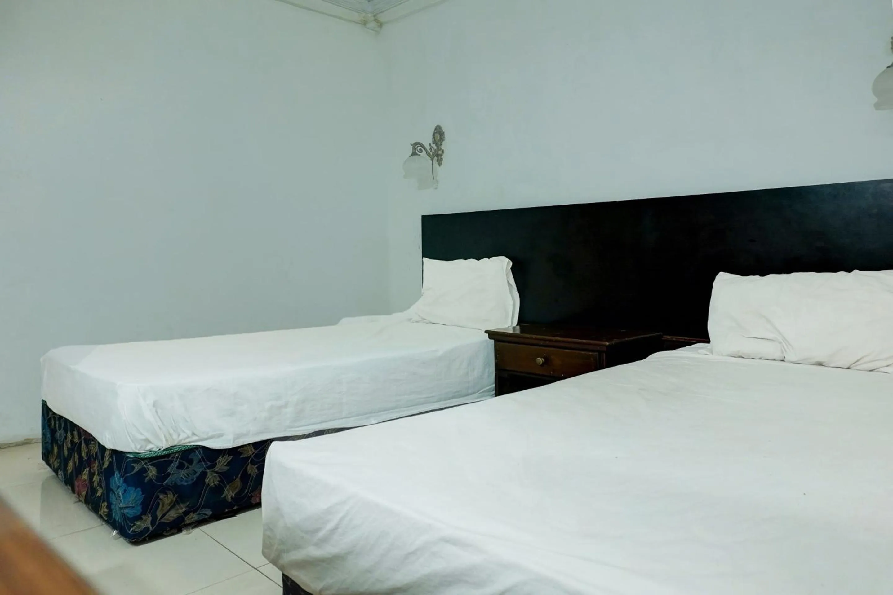 Bedroom in Hotel O Ervina Homestay Syariah Batakan