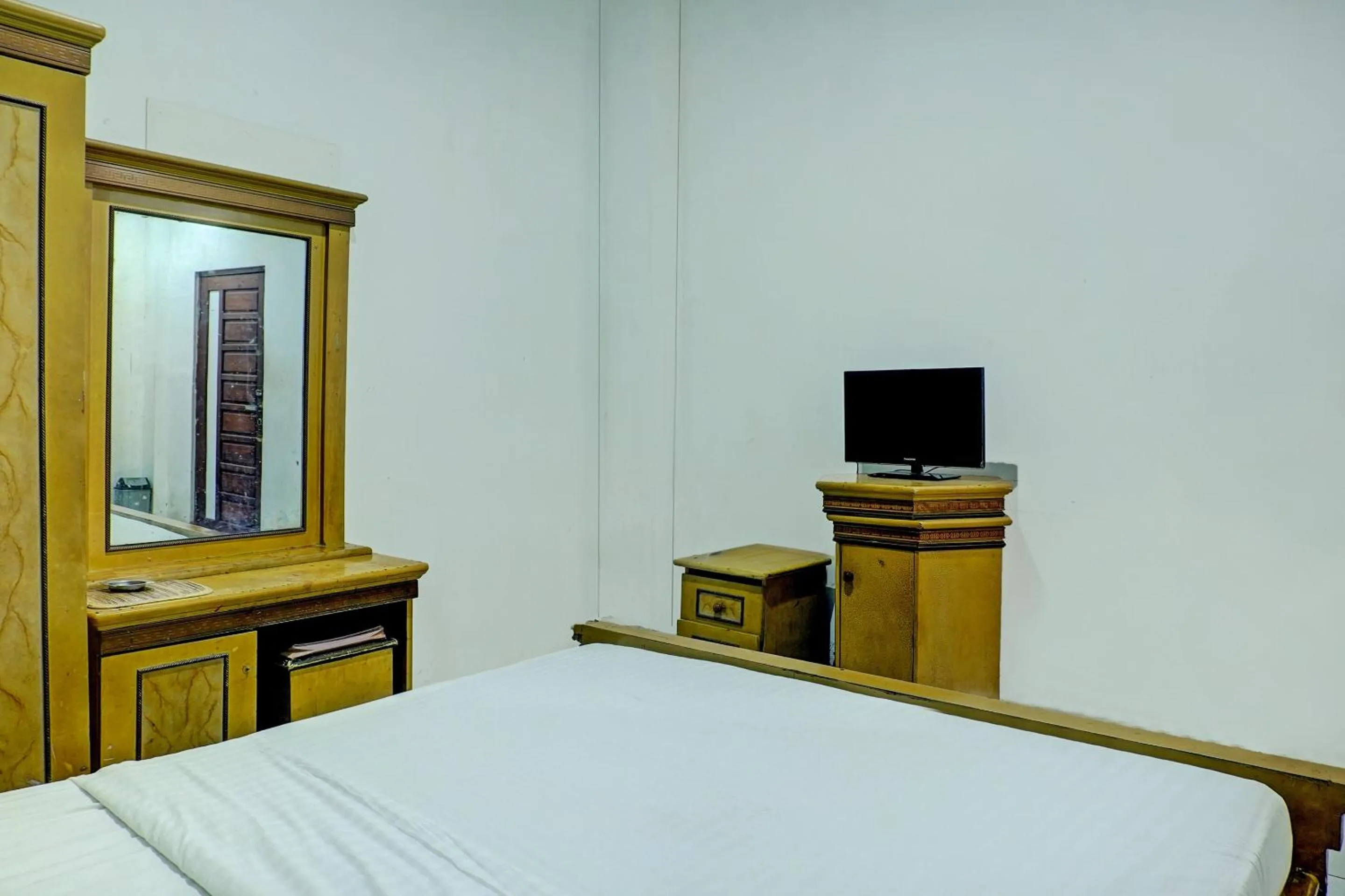 Bedroom in Hotel O Ervina Homestay Syariah Batakan